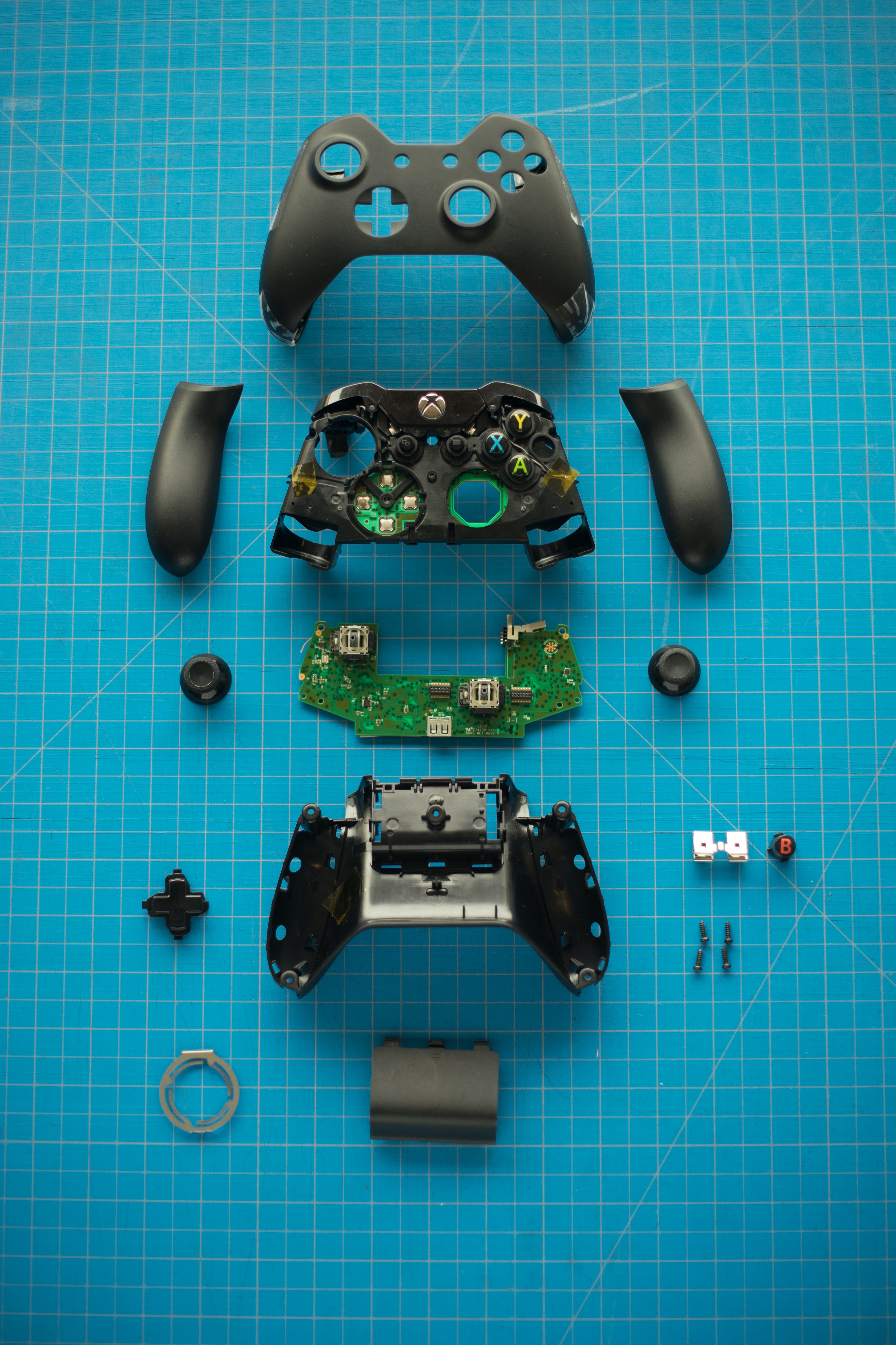 Xbox controller disassembled parts flat lay HD Phone Wallpaper