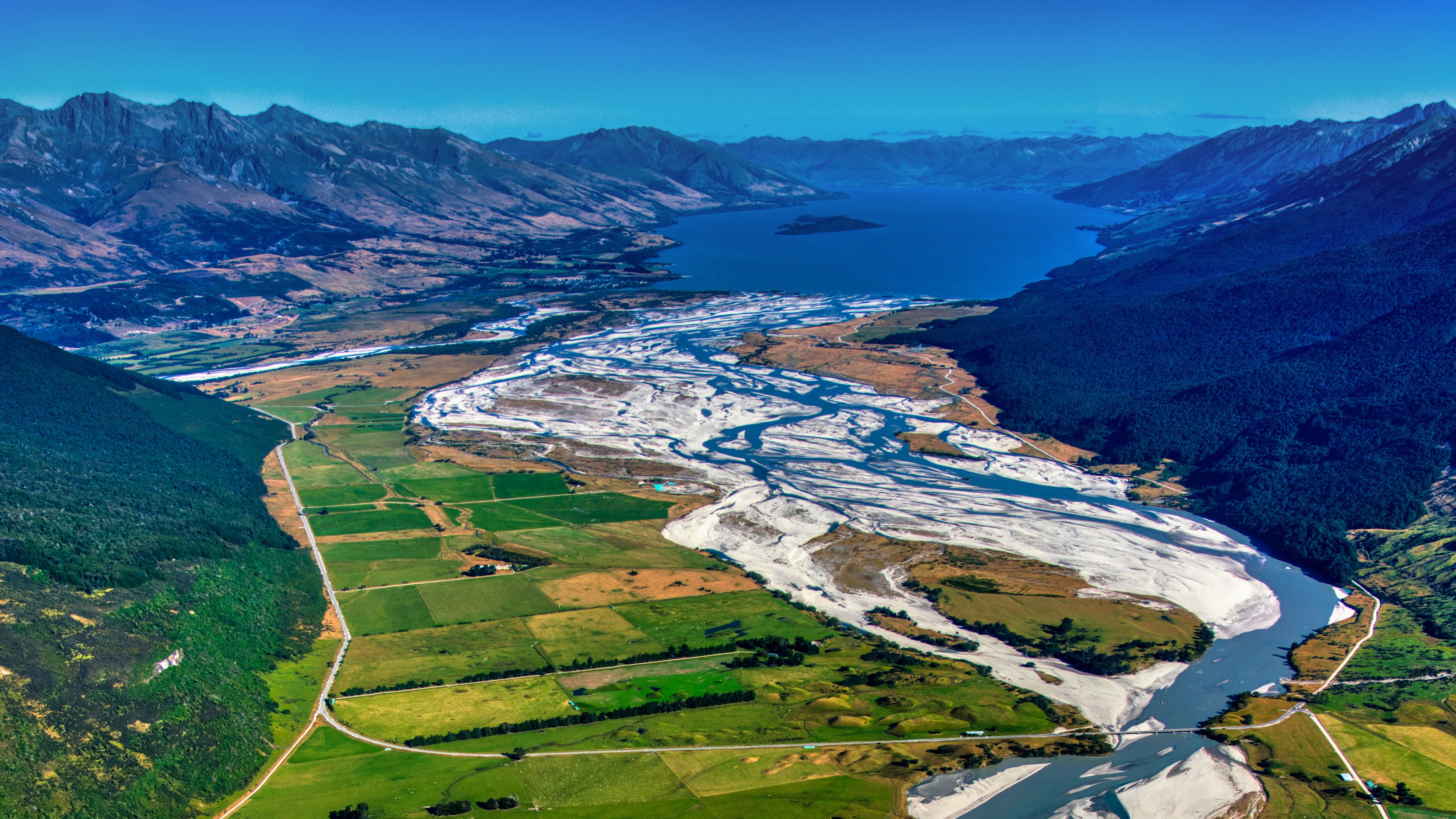 Aerial view of braided river and mountains in Queenstown region, New Zealand HD Wallpaper