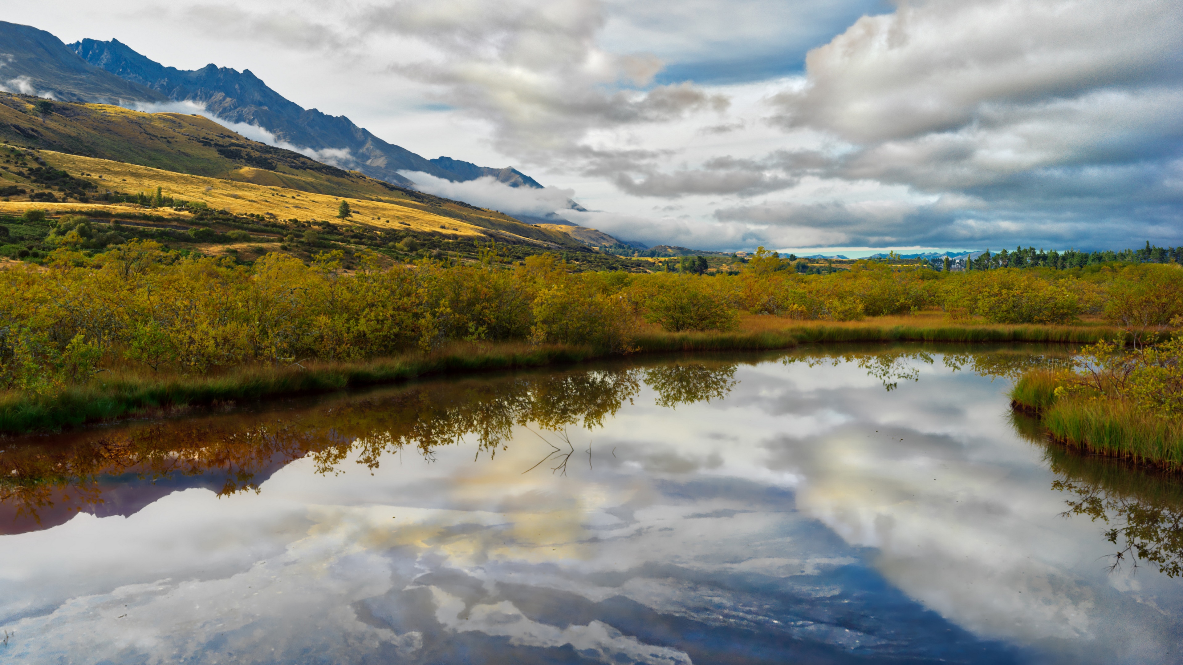 4K reflection of mountains and clouds over water in Glenorchy, New Zealand HD Wallpaper