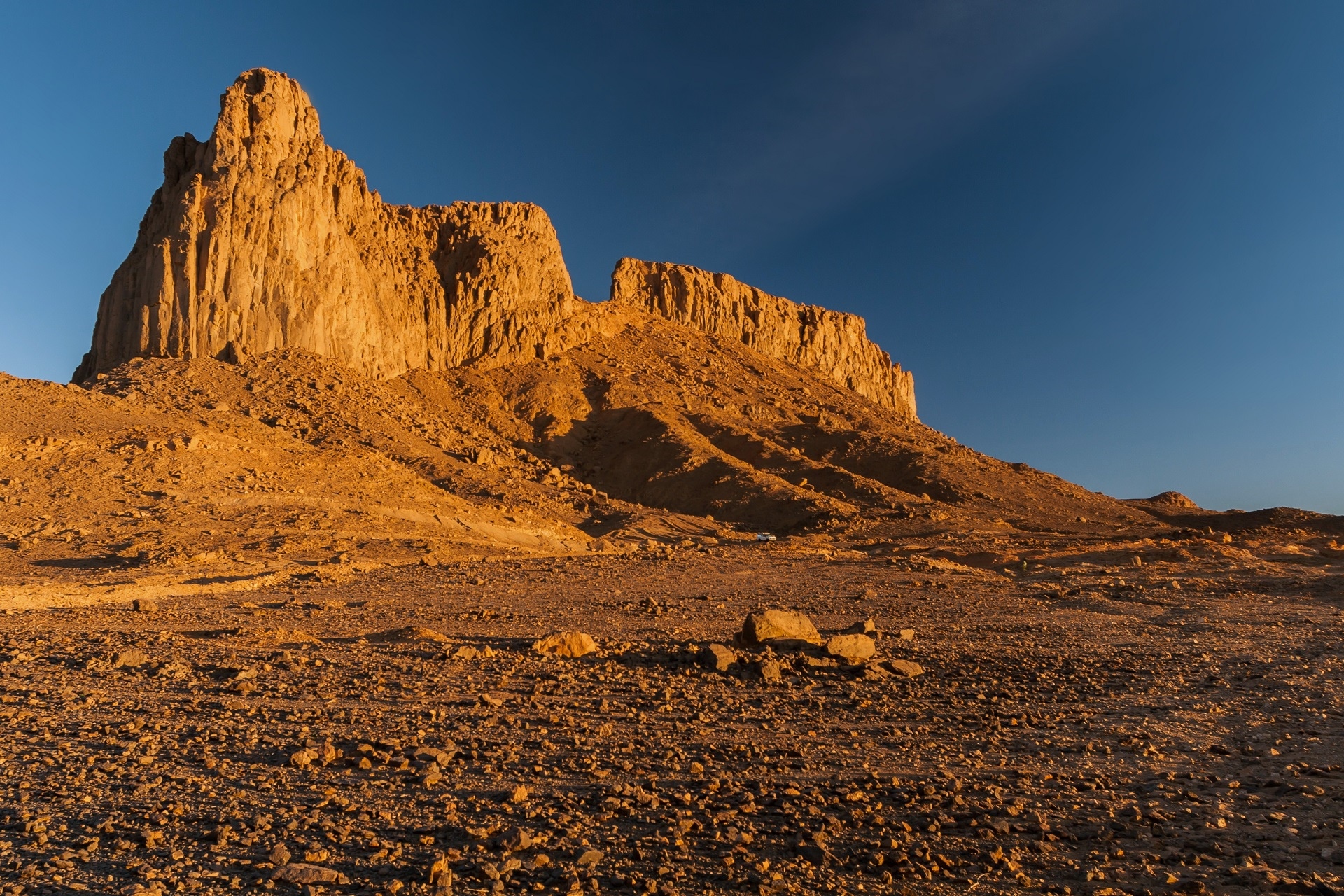Desert landscape with rock formations and clear blue sky HD Wallpaper