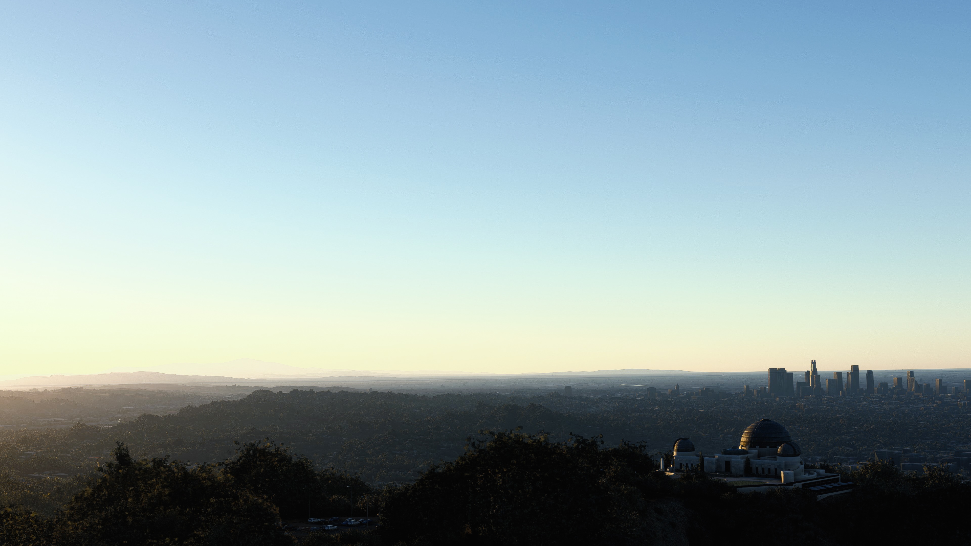 4K Griffith Observatory overlooking Los Angeles at sunset HD Wallpaper