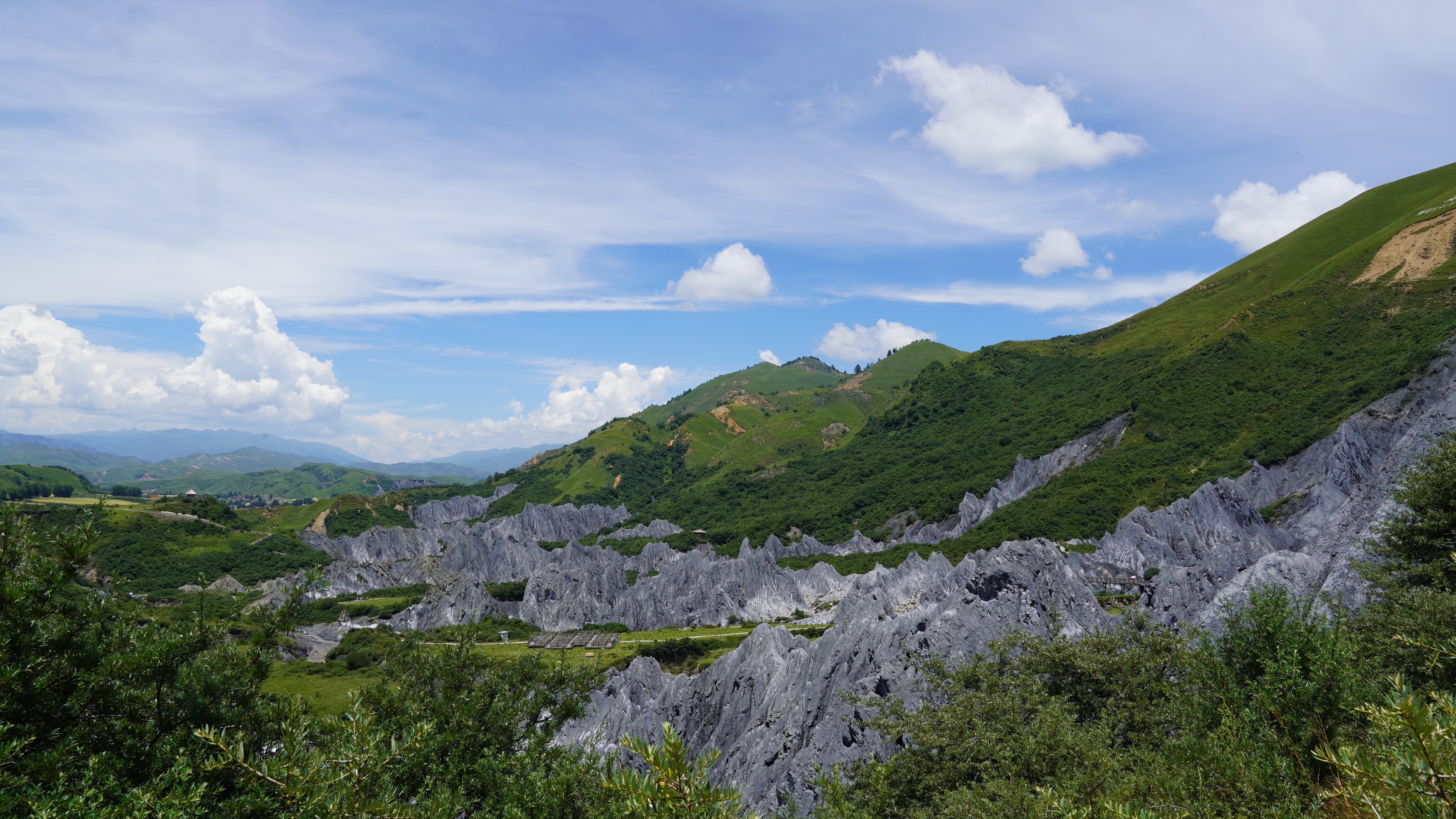4K clouds over mountains and karst landscape HD Wallpaper