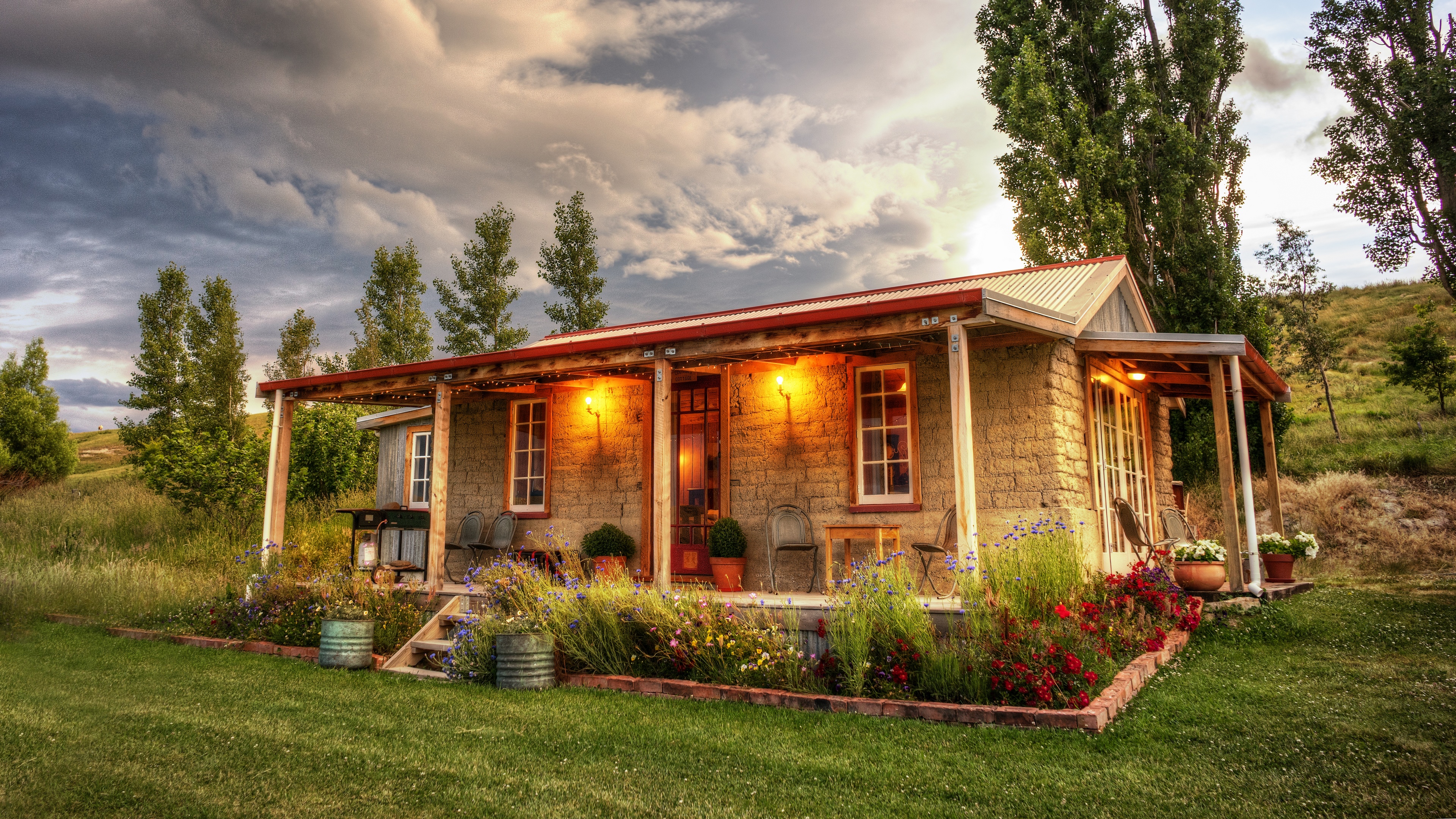 4K Cottage in St Bathans, New Zealand with Flowers and Trees HD Wallpaper