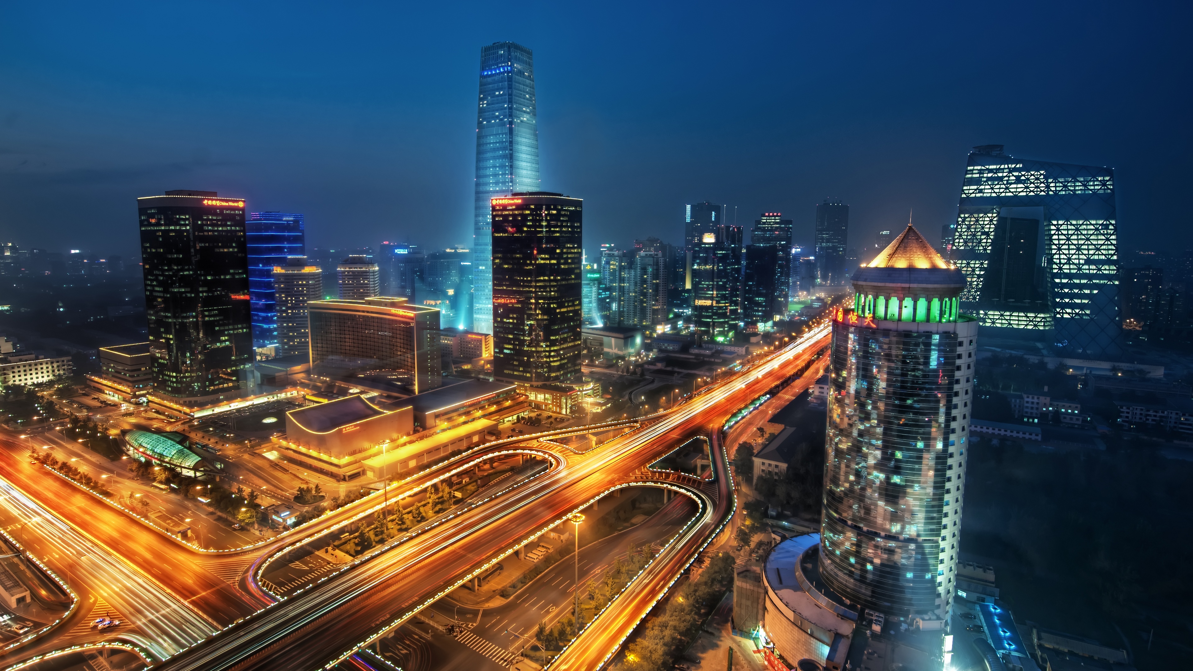 4K Beijing cityscape with illuminated skyscrapers and traffic at night HD Wallpaper
