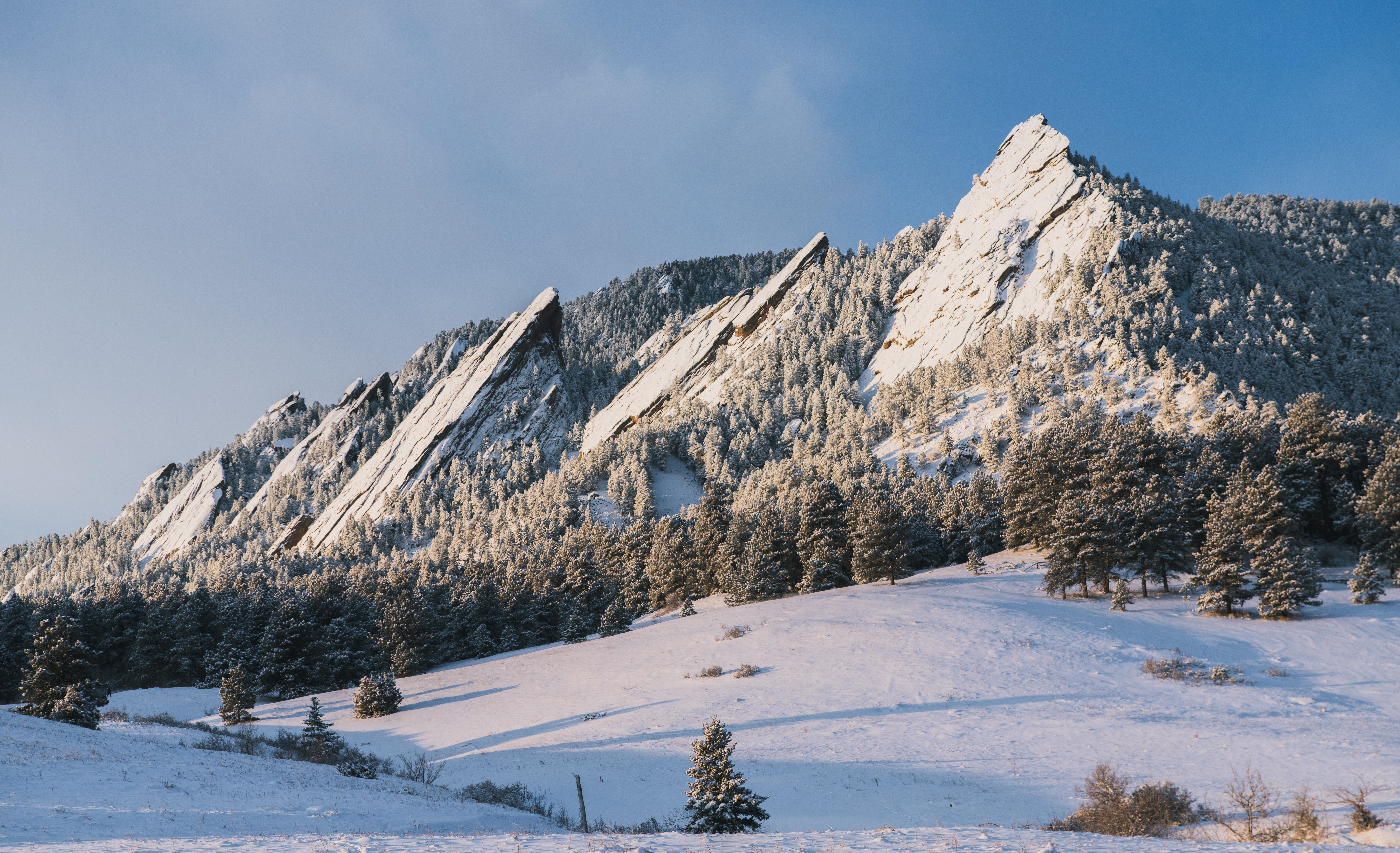 Snow-covered Flatirons in Colorado during winter HD Wallpaper