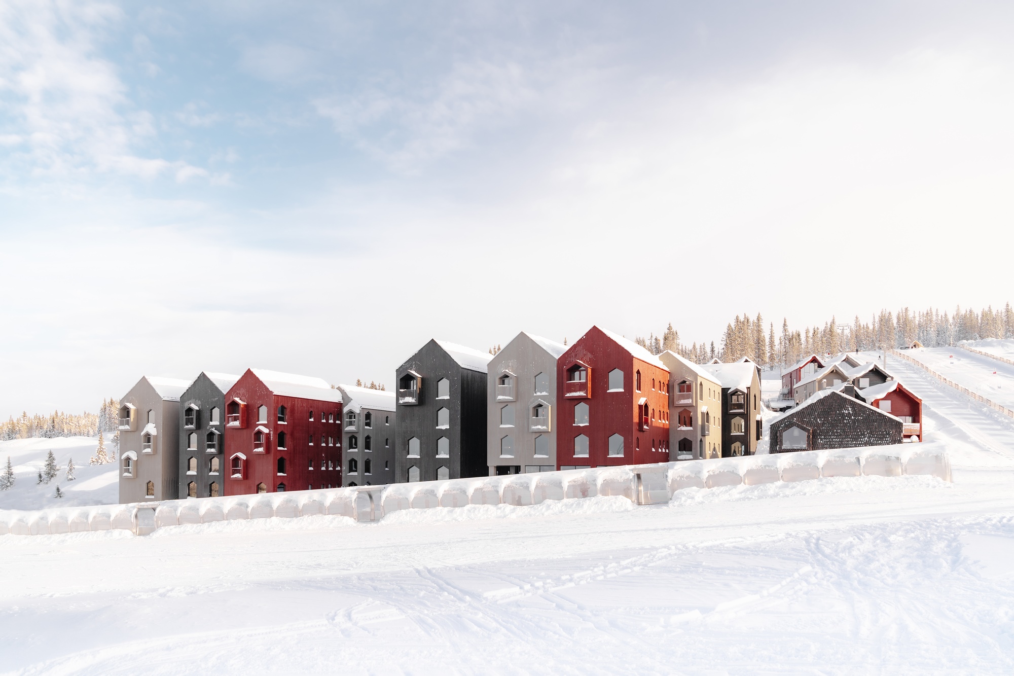 Modern buildings covered in snow with a winter landscape HD Wallpaper
