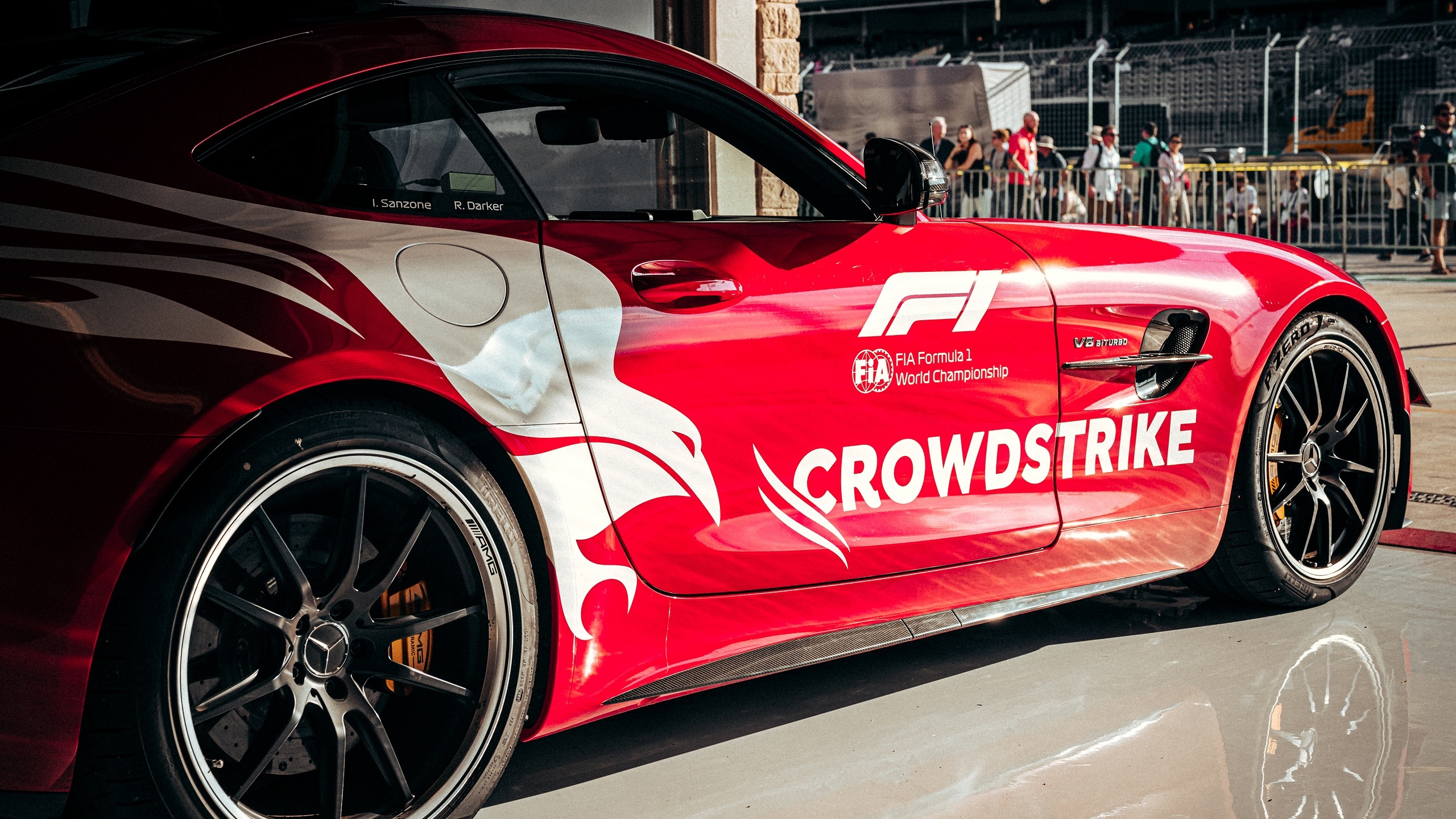 Red Mercedes-AMG GT Formula 1 Safety Car with Crowdstike branding HD Wallpaper