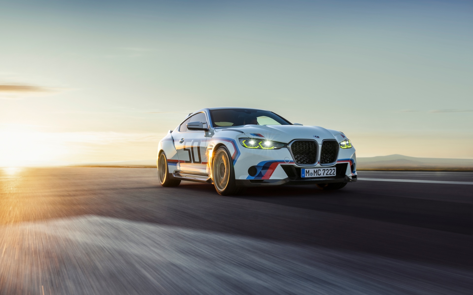BMW 3.0 CSL driving at sunset HD Wallpaper