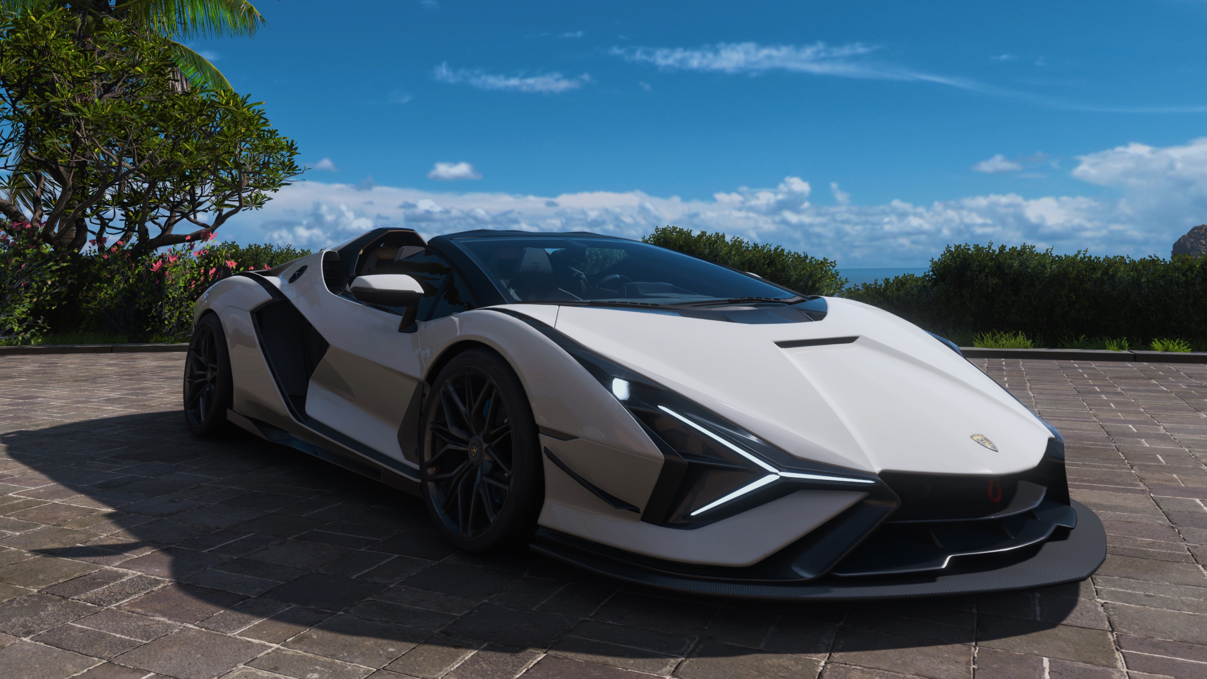 White Lamborghini sports car on paved surface HD Wallpaper