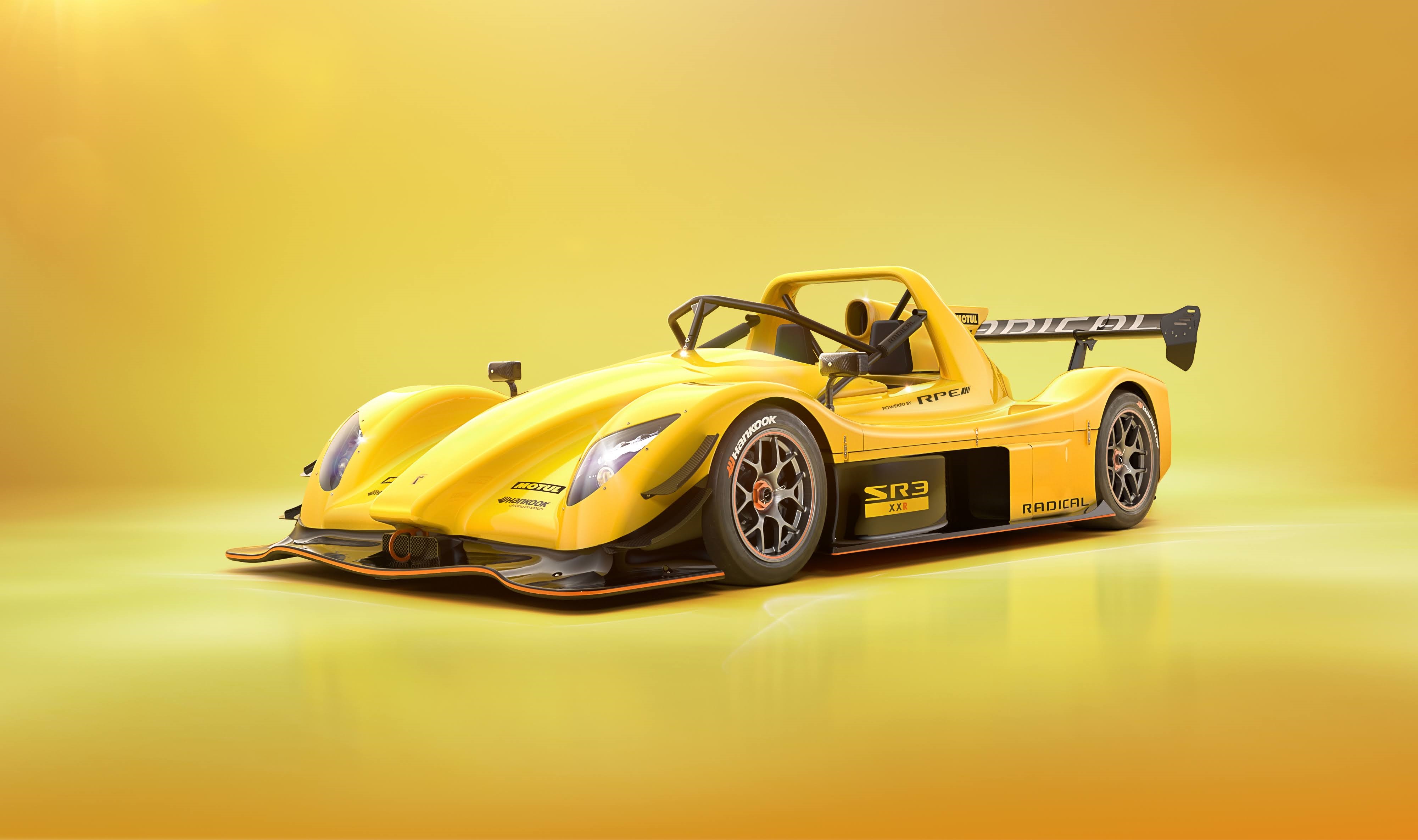 Radical SR3 race car on a yellow background HD Wallpaper