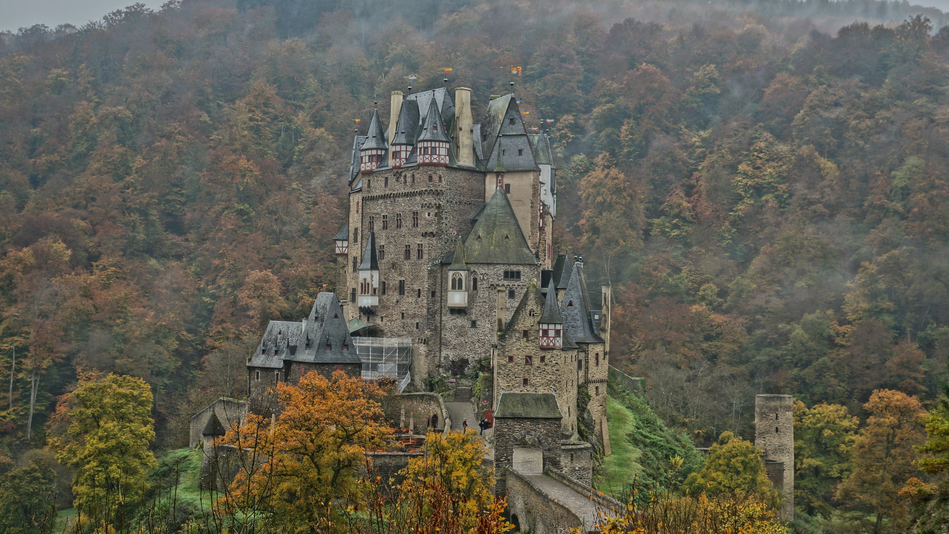 4K Eltz Castle surrounded by autumn trees HD Wallpaper