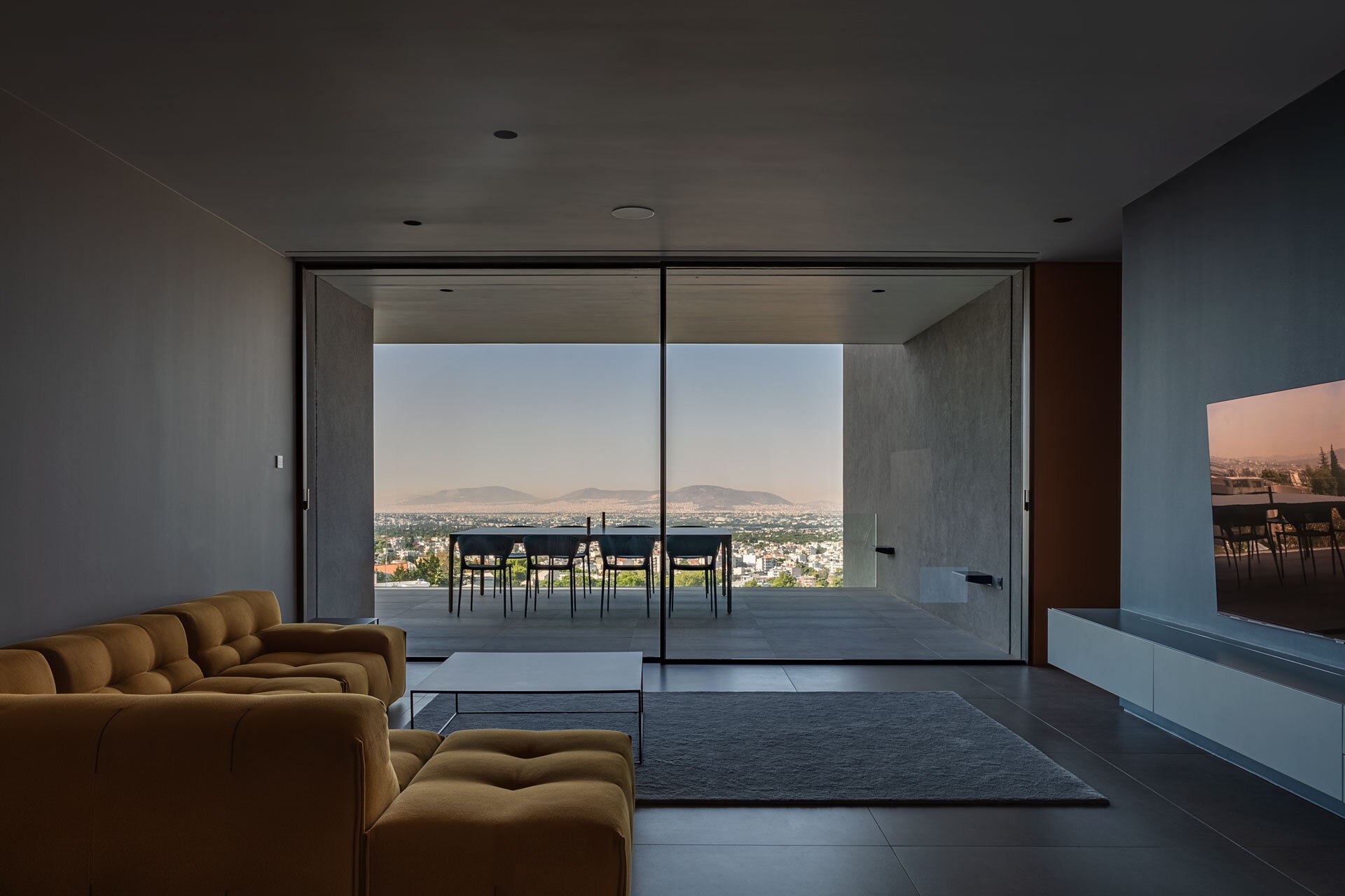 Modern living room with large windows and city view HD Wallpaper