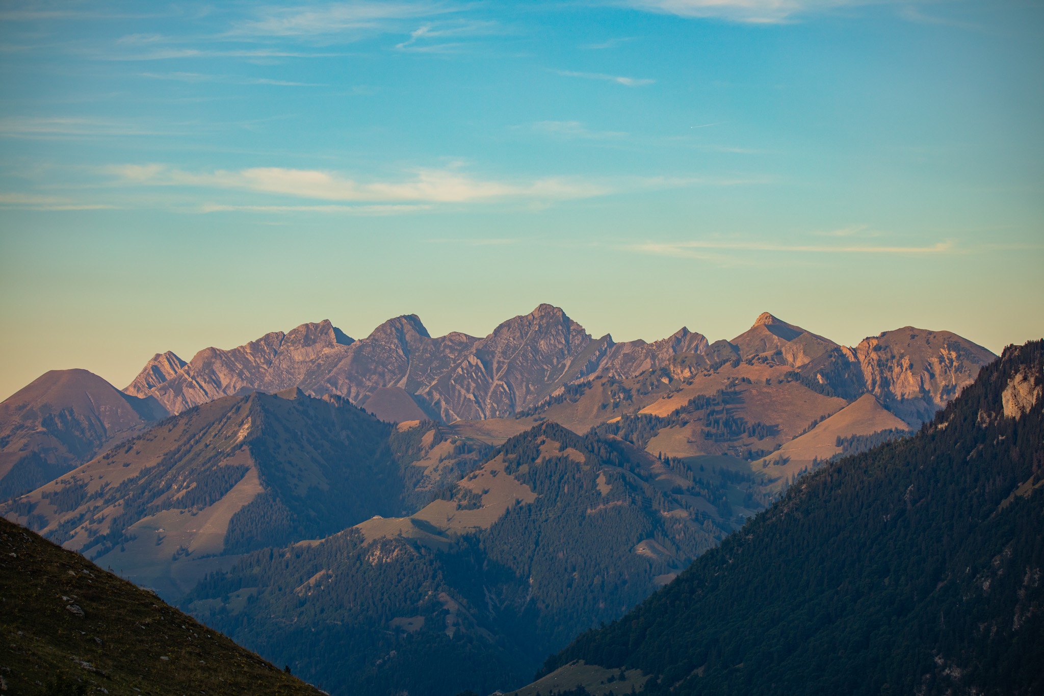 Mountain range in Switzerland under a clear blue sky HD Wallpaper