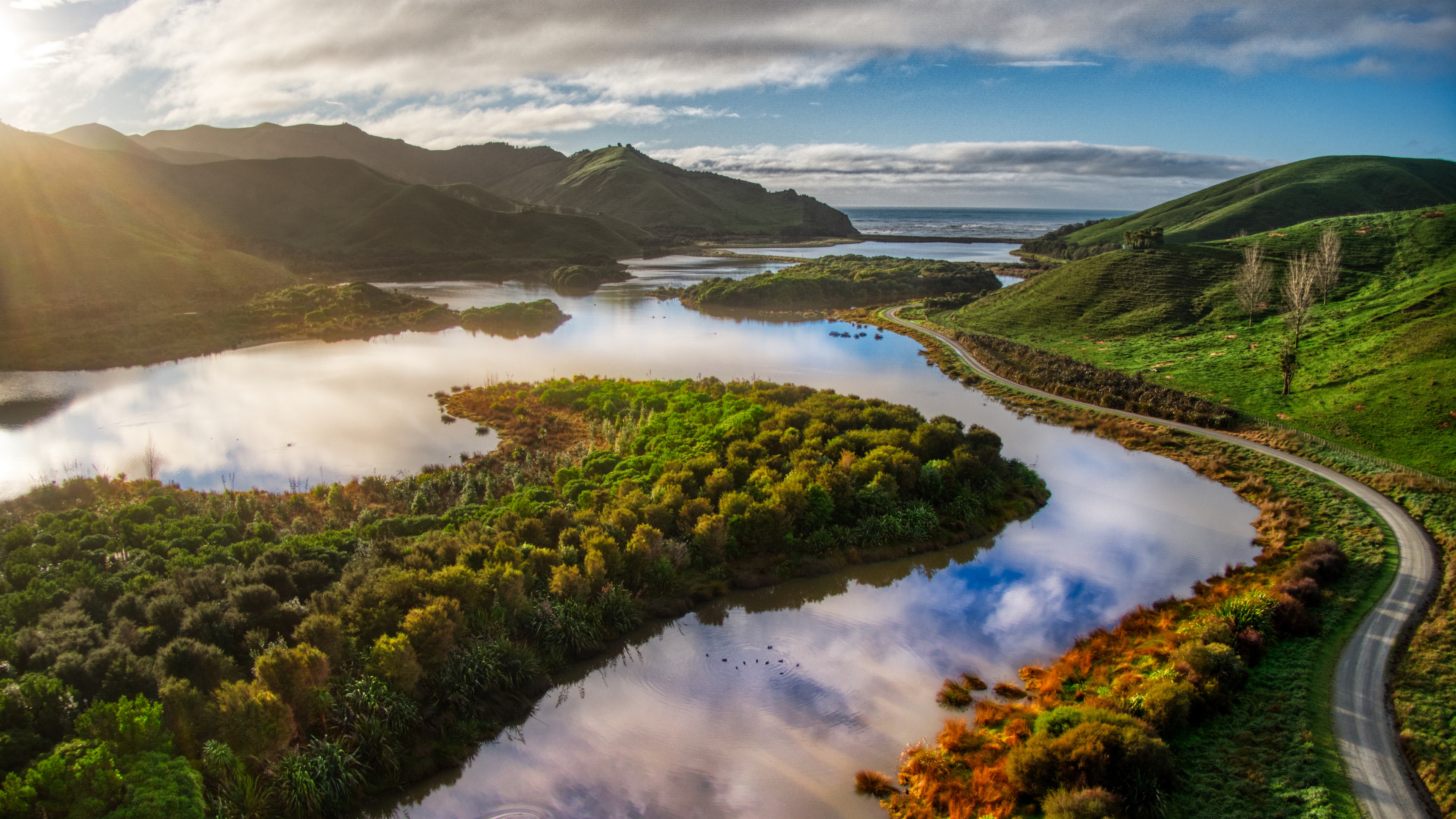 4K Landscape with Mountains, Water, and Road HD Wallpaper