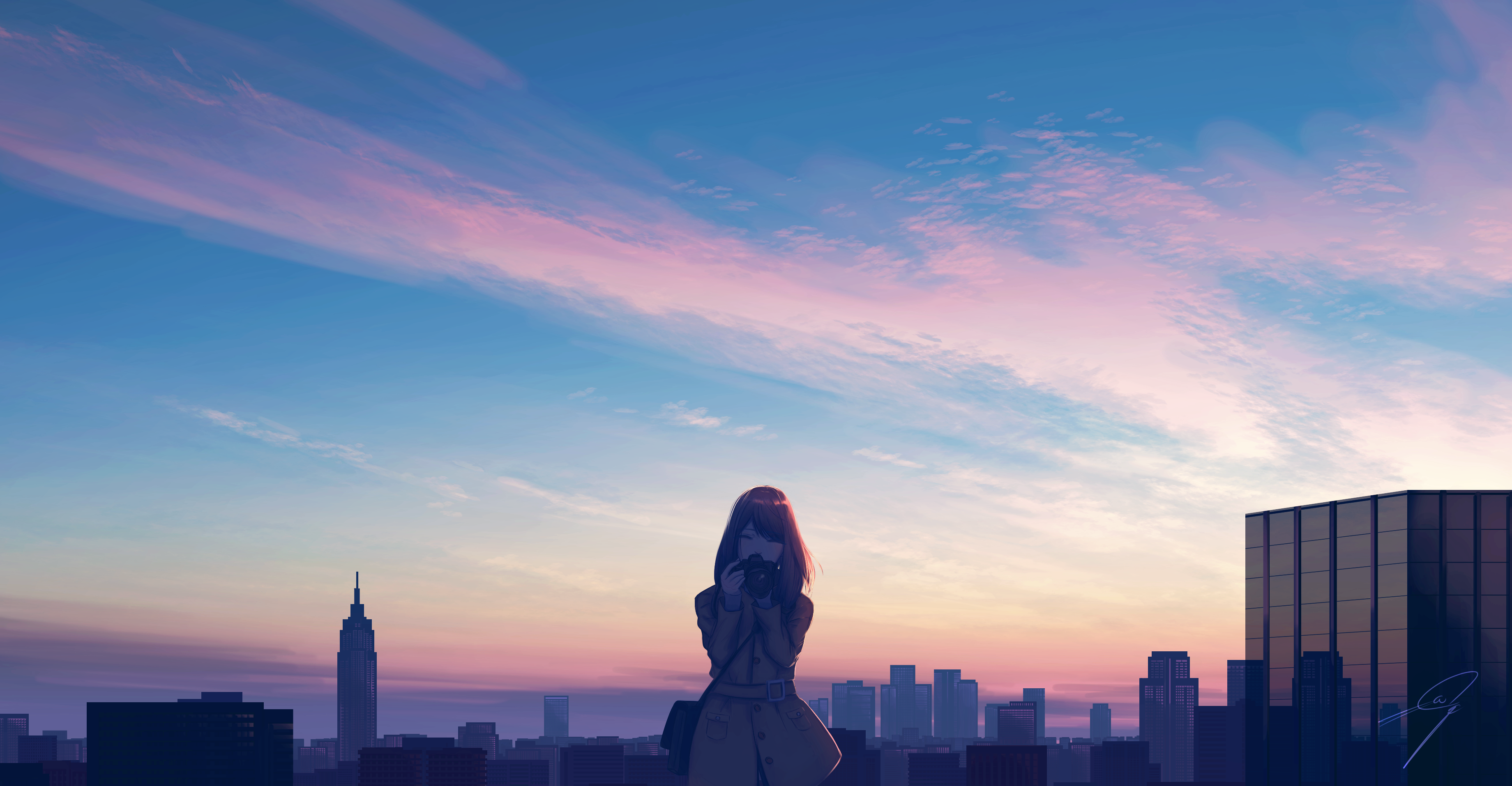 Woman with camera on rooftop overlooking cityscape at sunset HD Wallpaper