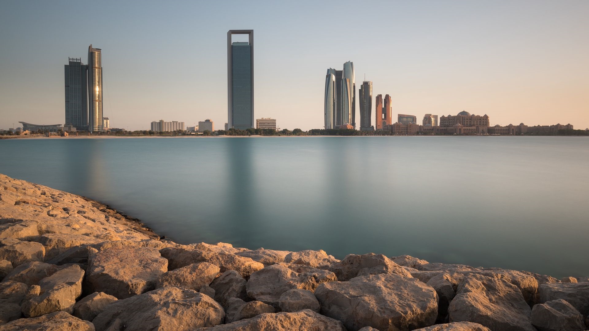 Abu Dhabi skyline with skyscrapers and water HD Wallpaper
