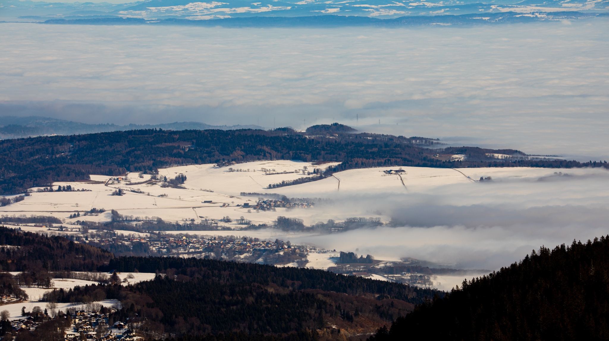 Winter valley with snow-covered fields and clouds HD Wallpaper