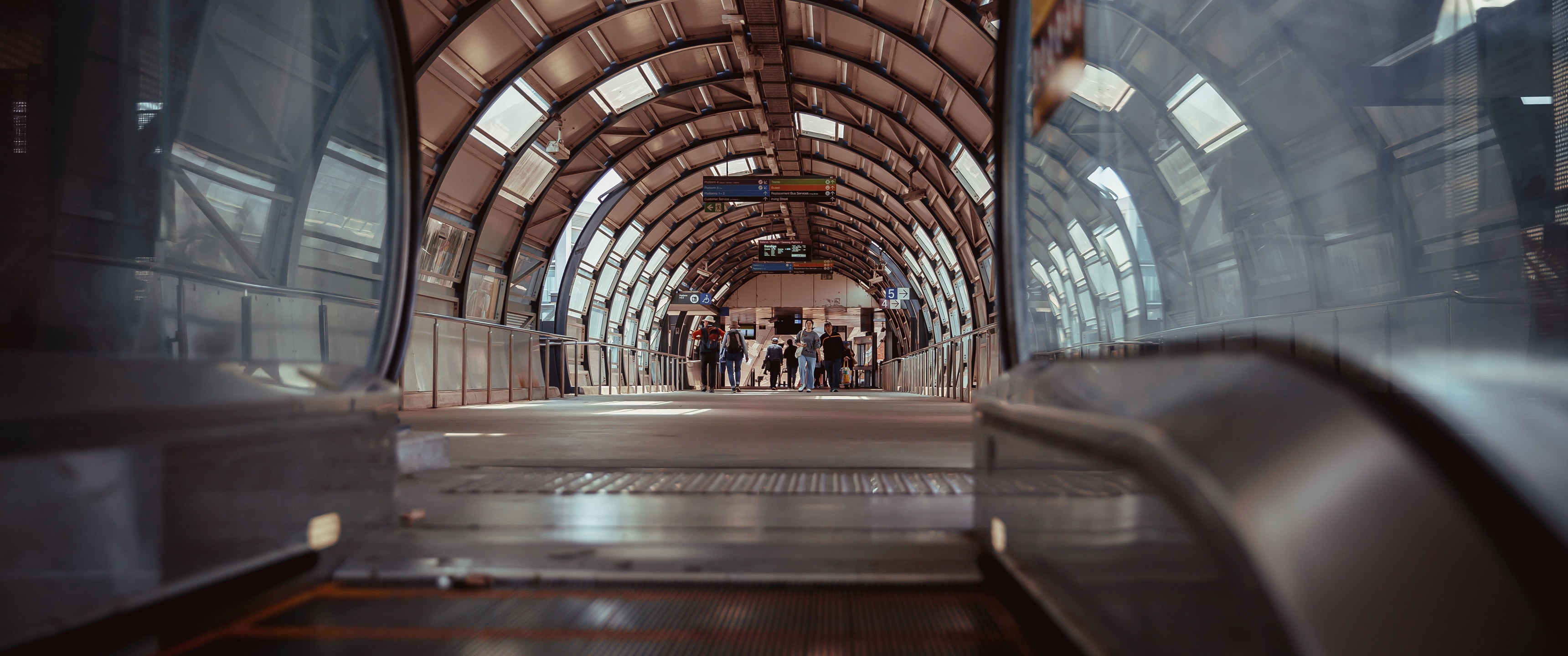 Interior of a modern train station walkway in Melbourne HD Wallpaper