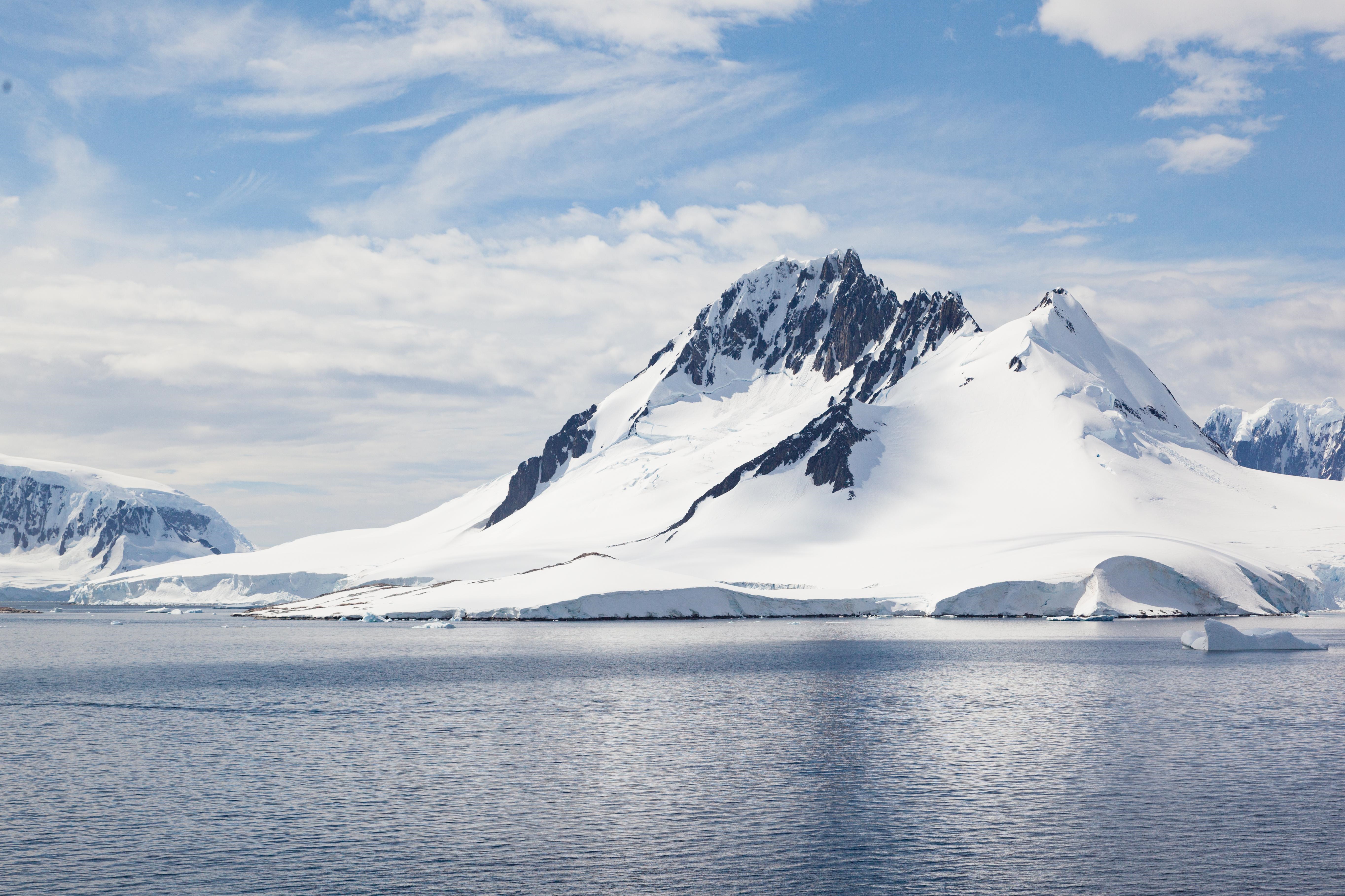 4K Antarctica snow-capped mountains and water HD Wallpaper