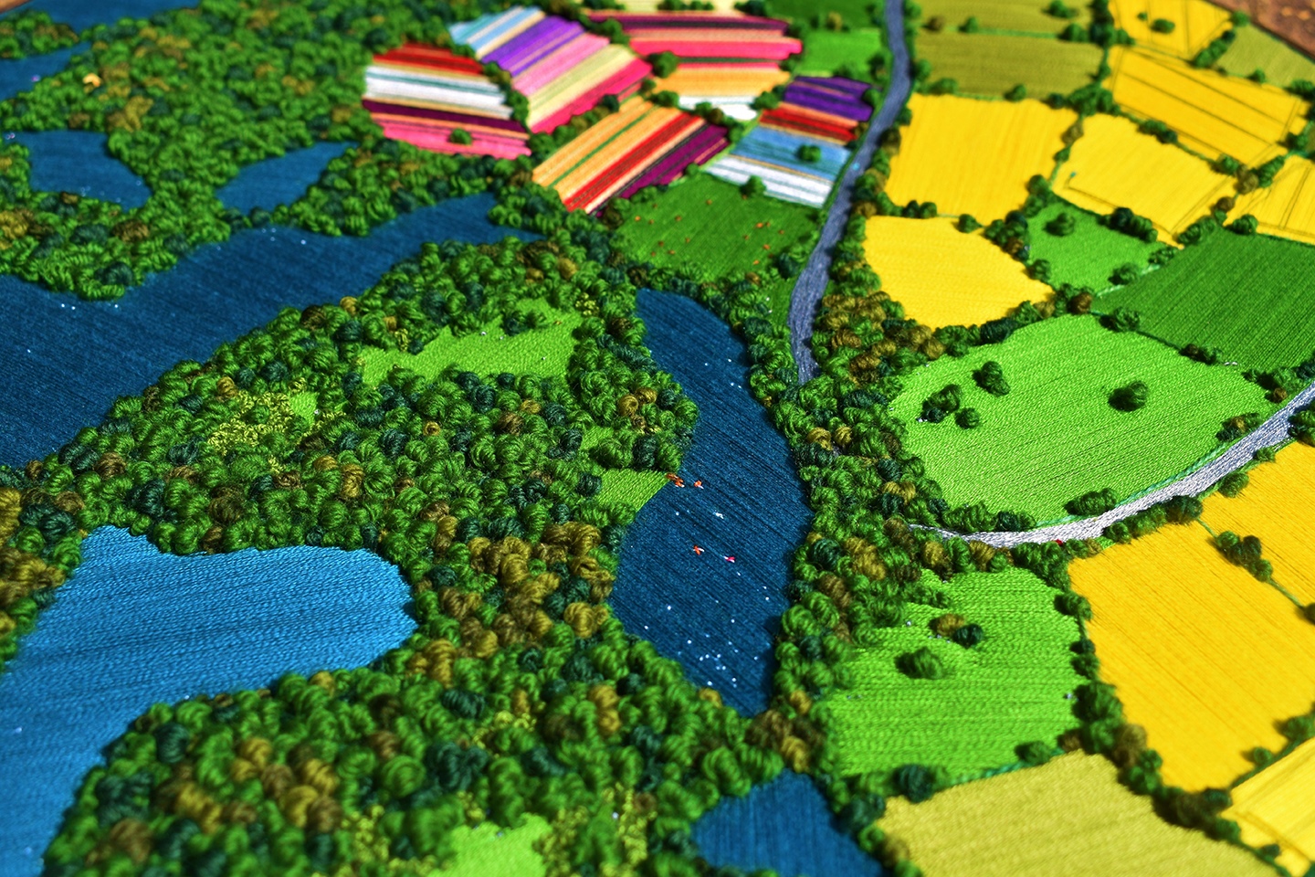Embroidery landscape with fields and a lake HD Wallpaper