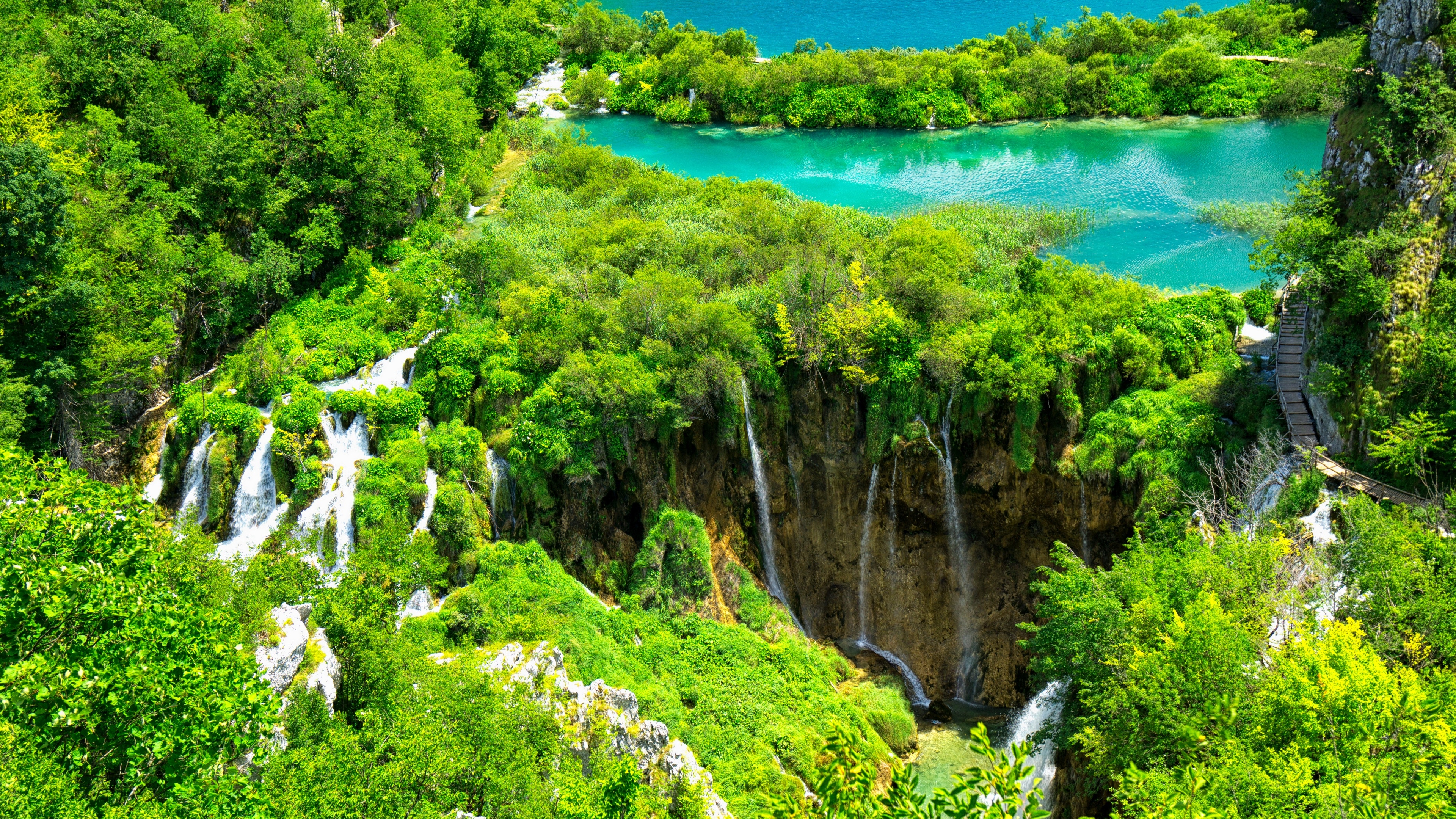 4K nature scene with waterfalls and a turquoise lake HD Wallpaper
