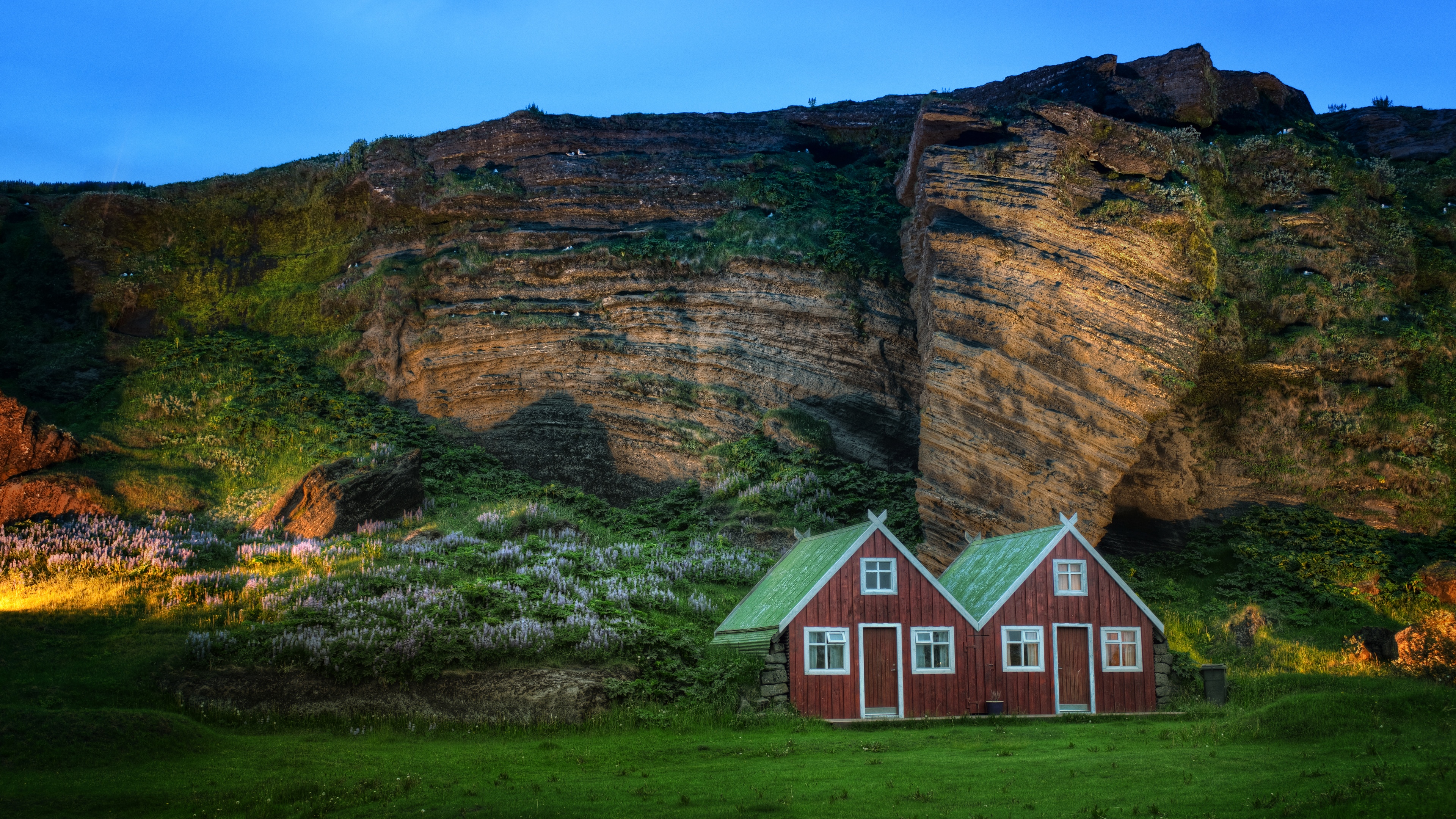 4K Iceland landscape with houses and rock wall HD Wallpaper