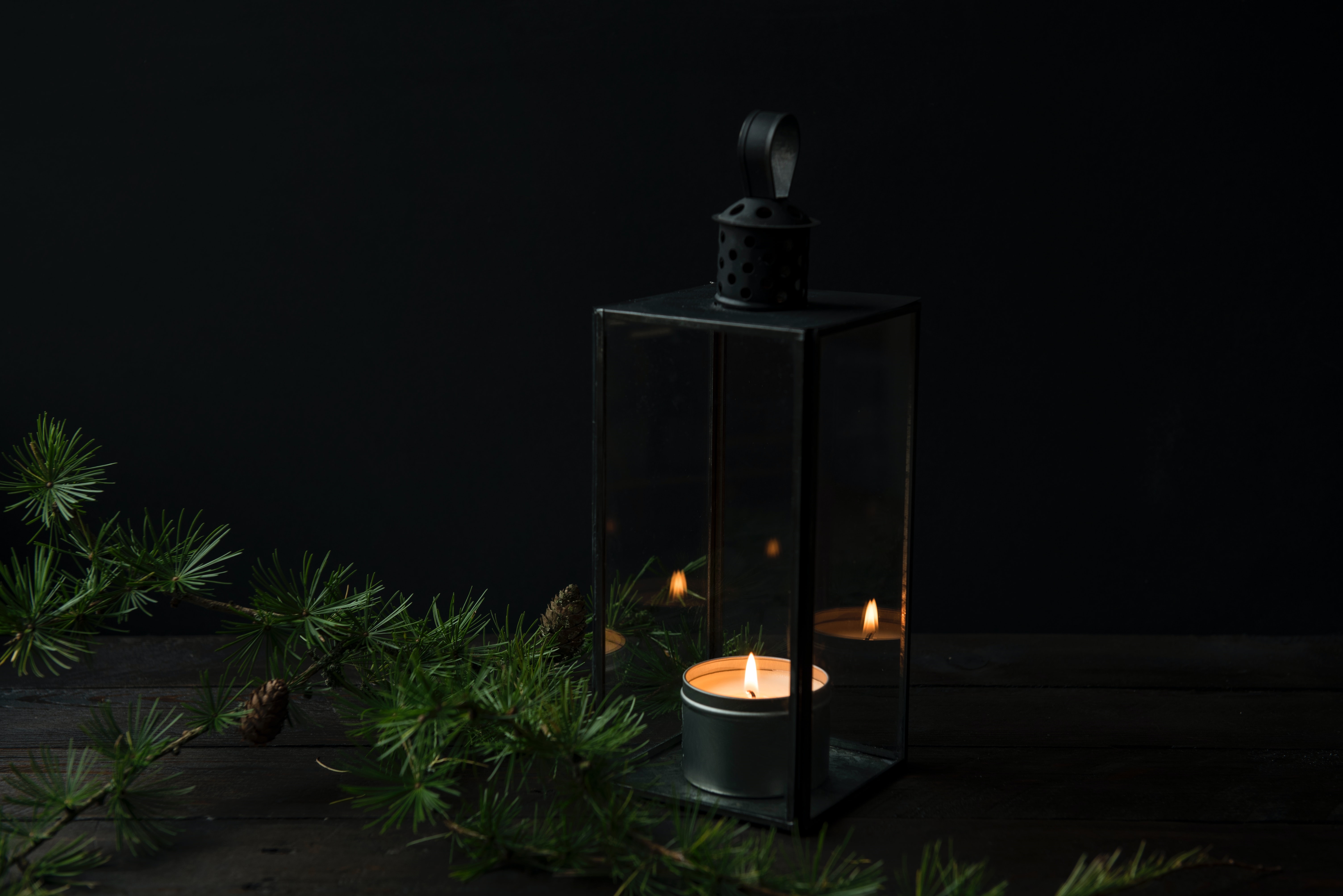 Lantern with candle and pine needles HD Wallpaper