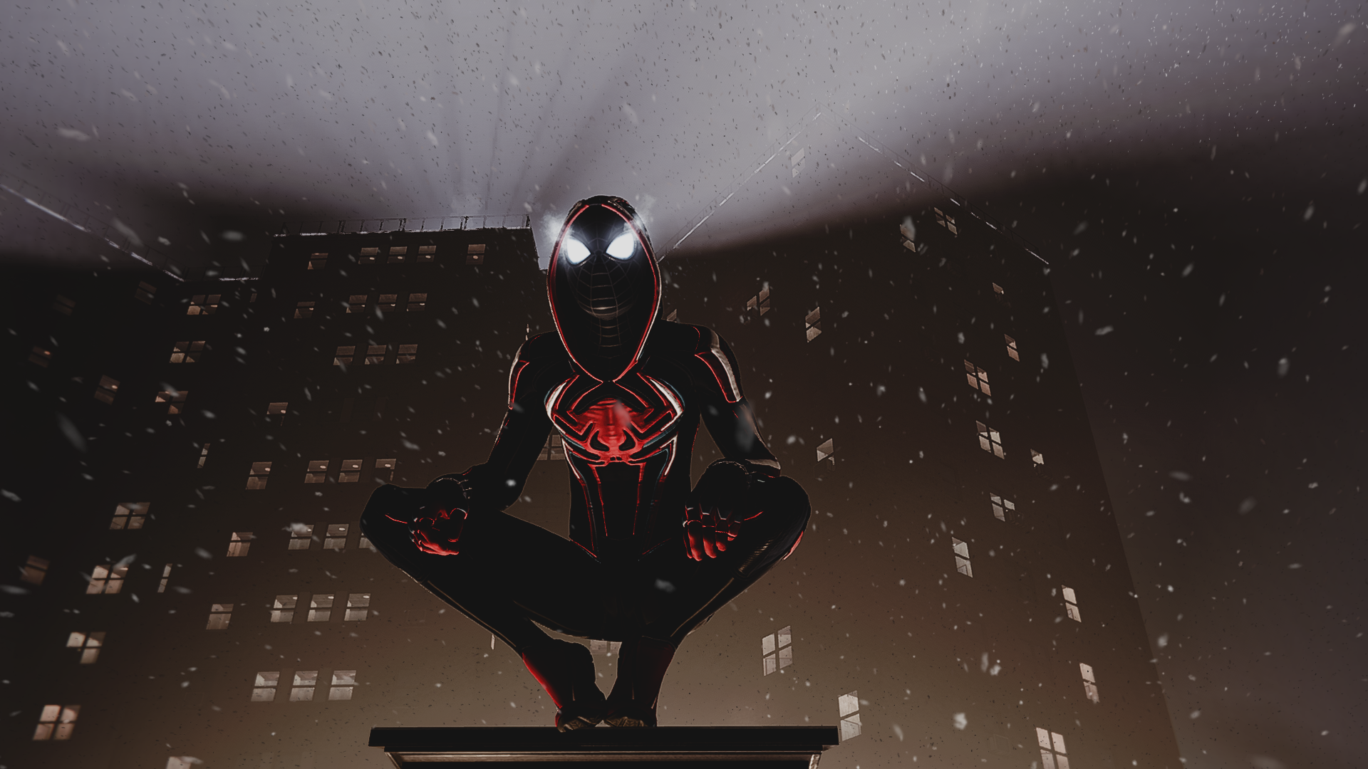 Miles Morales in a black and red suit crouches HD Wallpaper