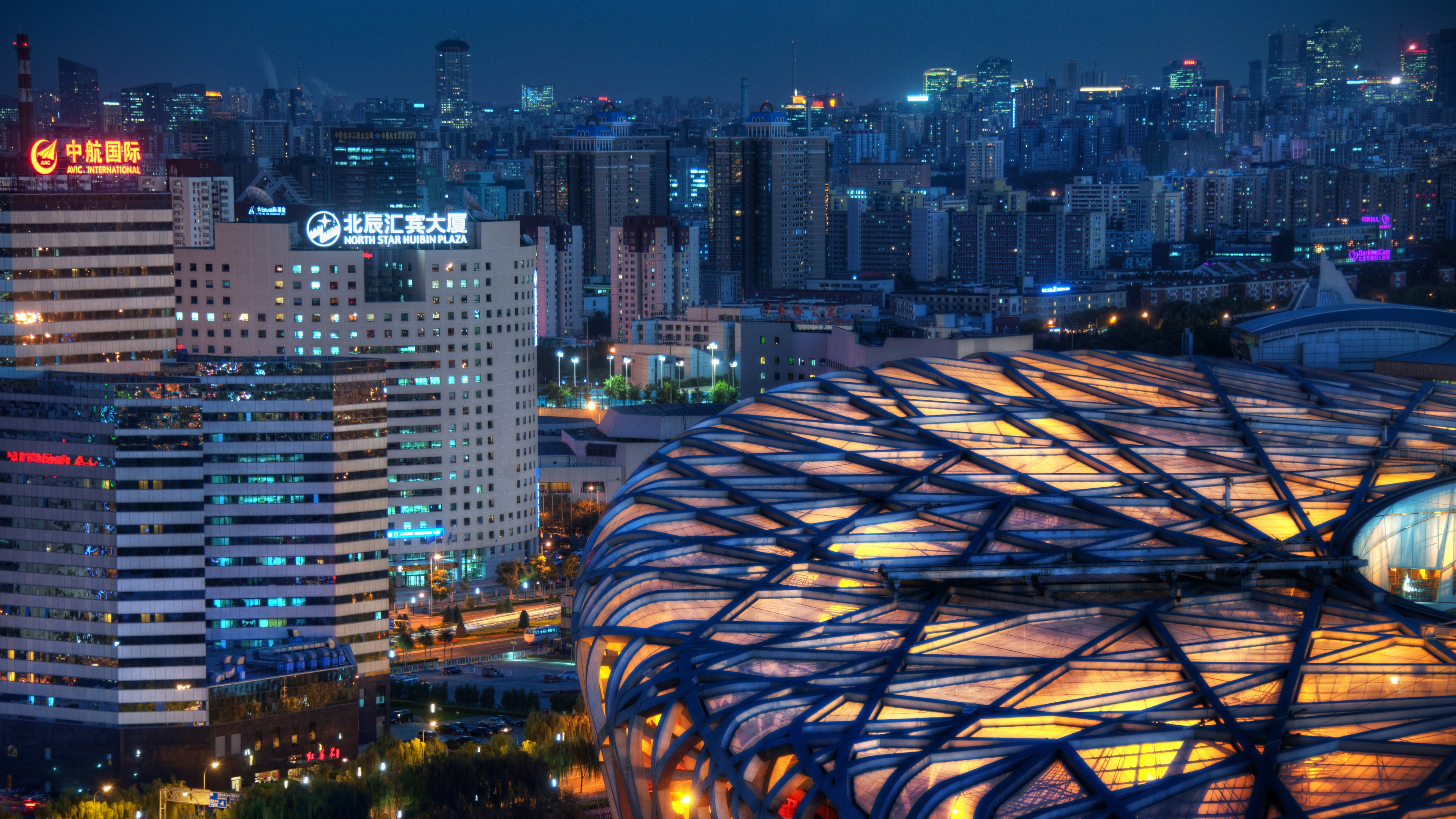 4K Bird's Nest Stadium and Beijing Cityscape at Night HD Wallpaper