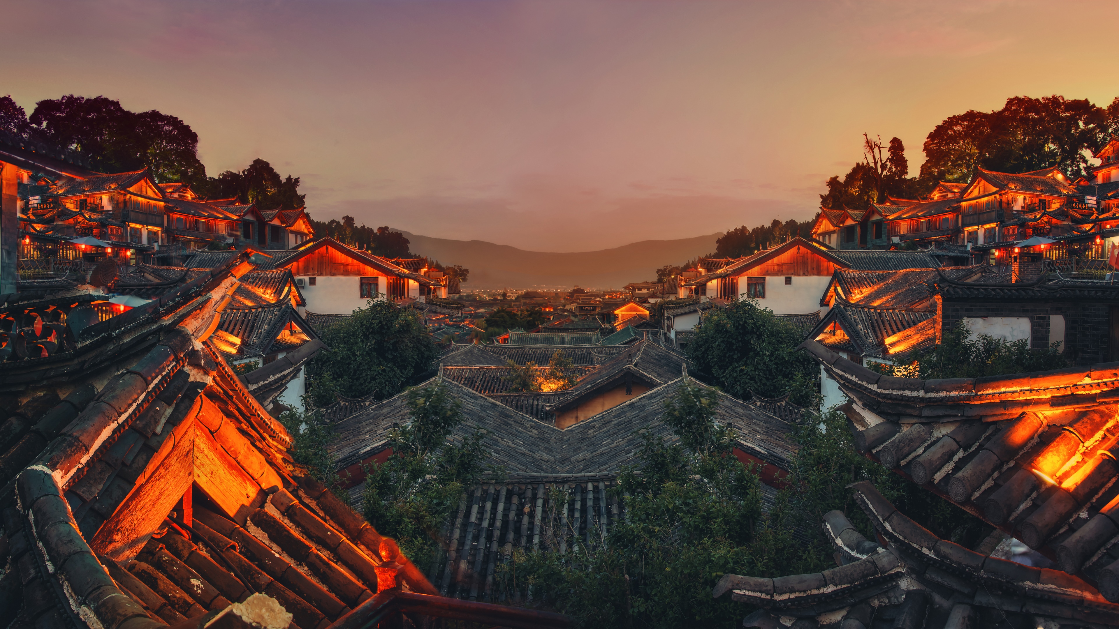 4K Lijiang City cityscape at sunset with mountains HD Wallpaper