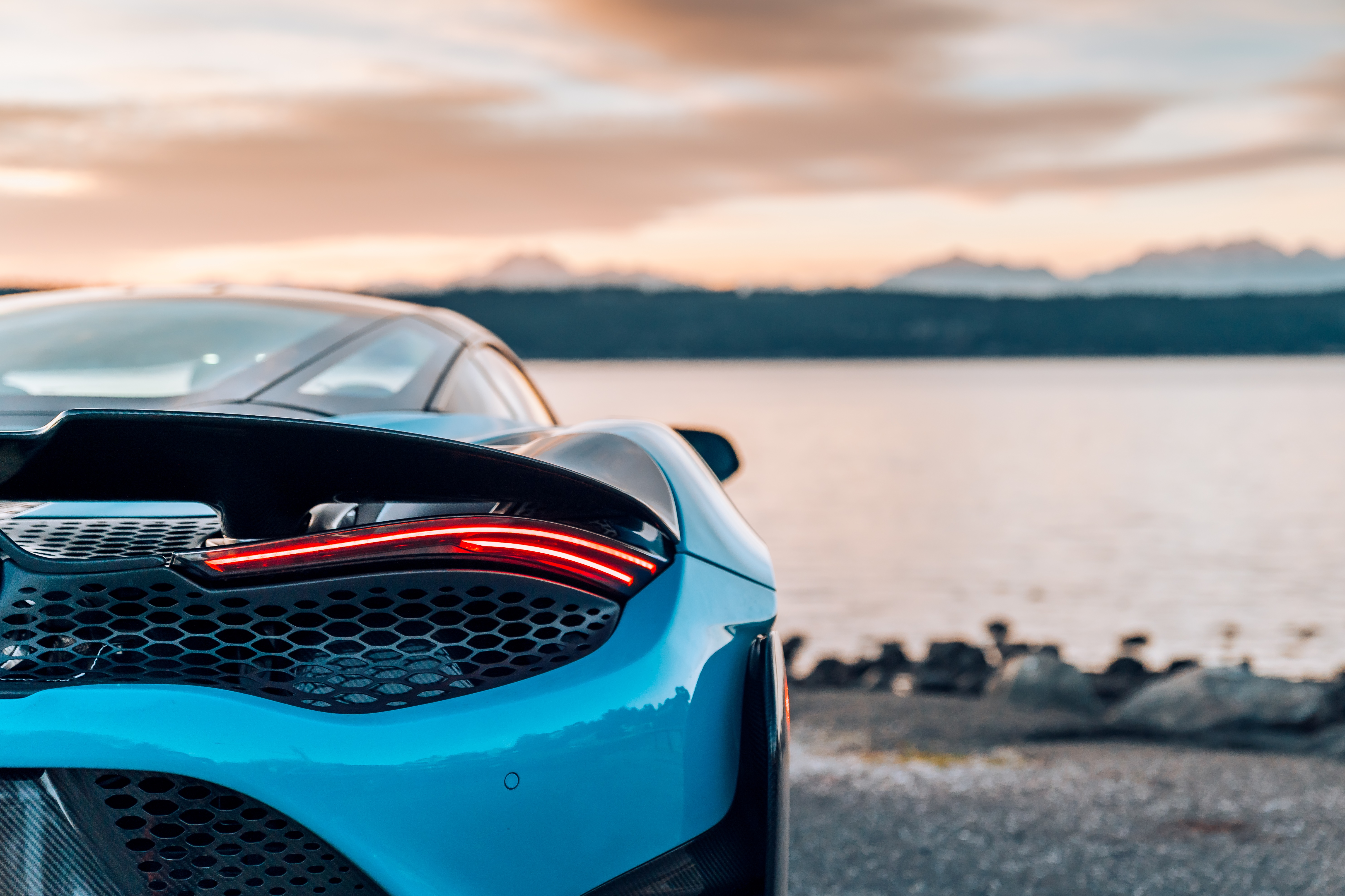 Blue McLaren car taillights by the water HD Wallpaper