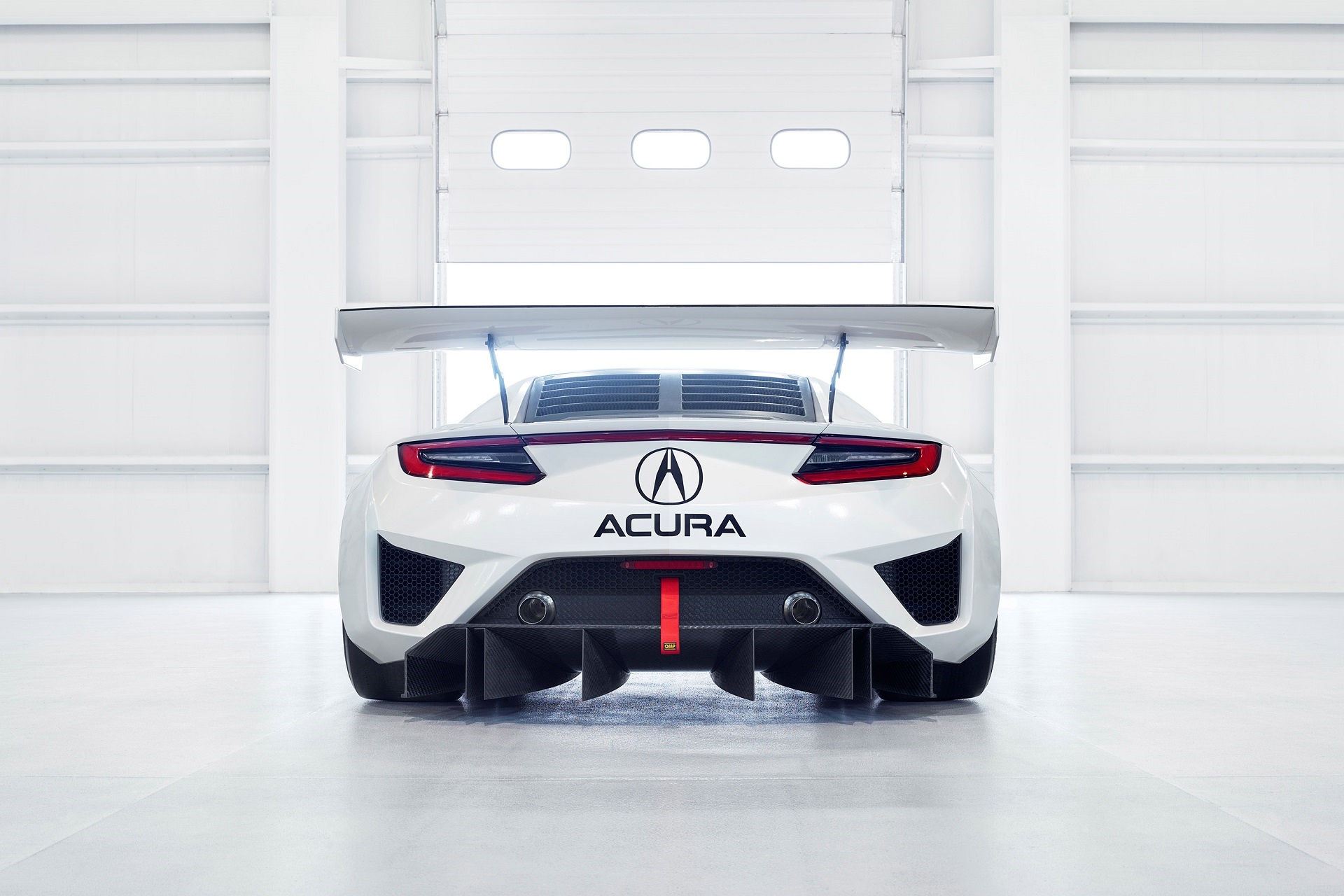 Acura NSX GT3 race car in a garage HD Wallpaper