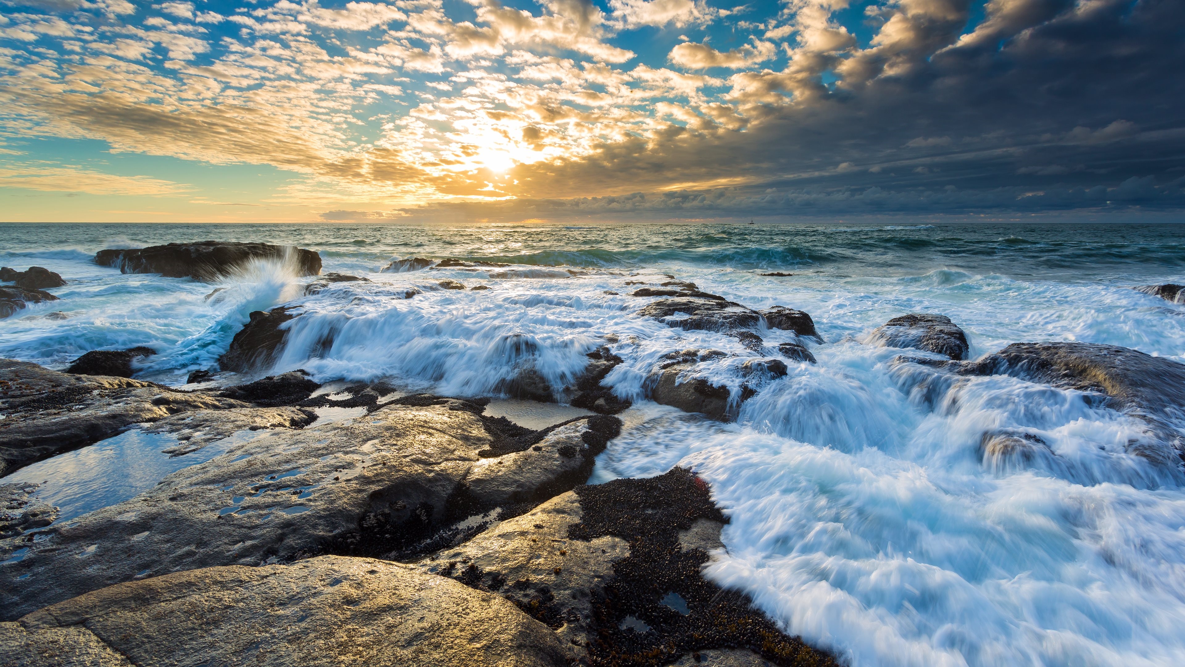 4K Sunset over Rocky Coastline with Waves HD Wallpaper