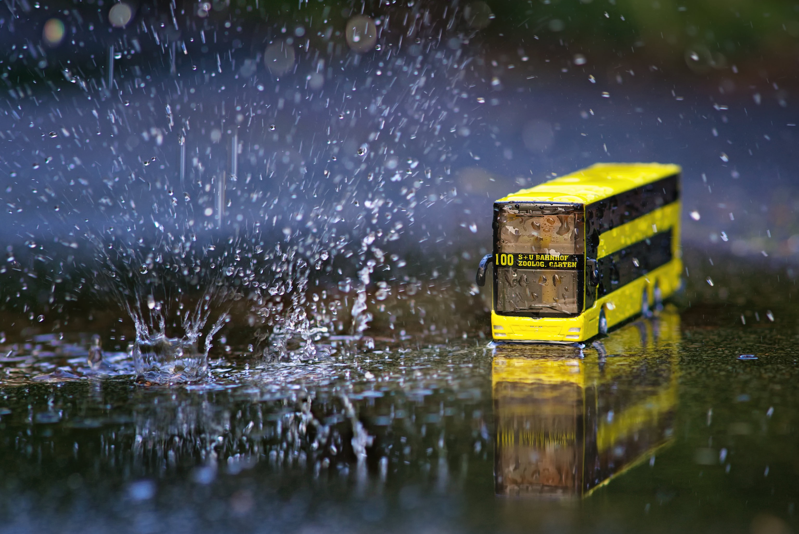Yellow double-decker bus in the rain HD Wallpaper