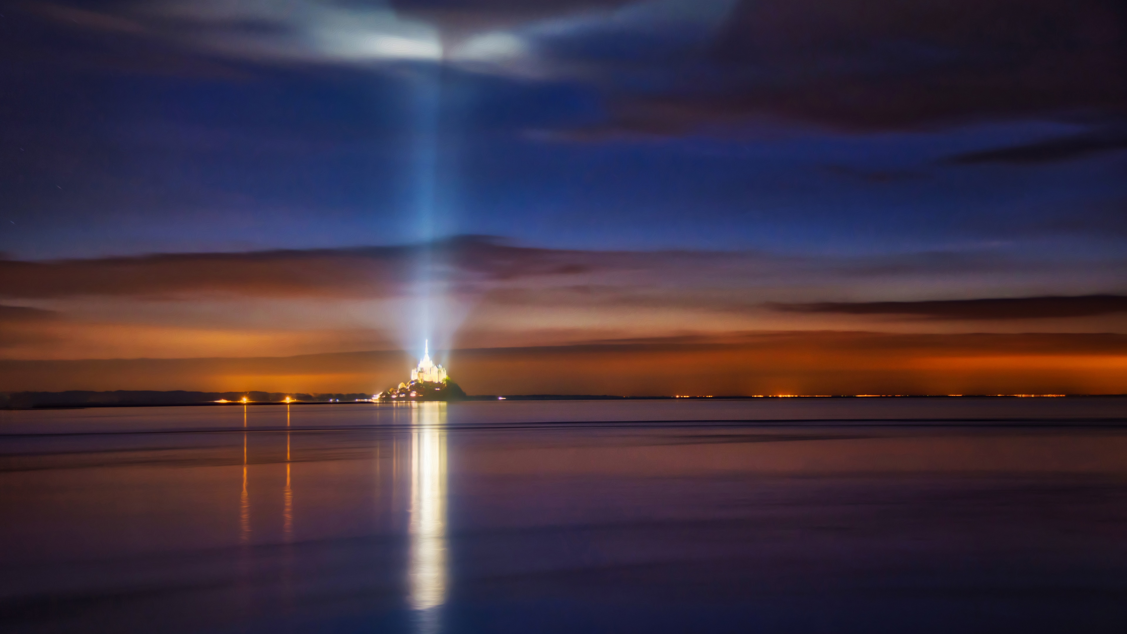 4K Mont Saint-Michel at night with light beam HD Wallpaper