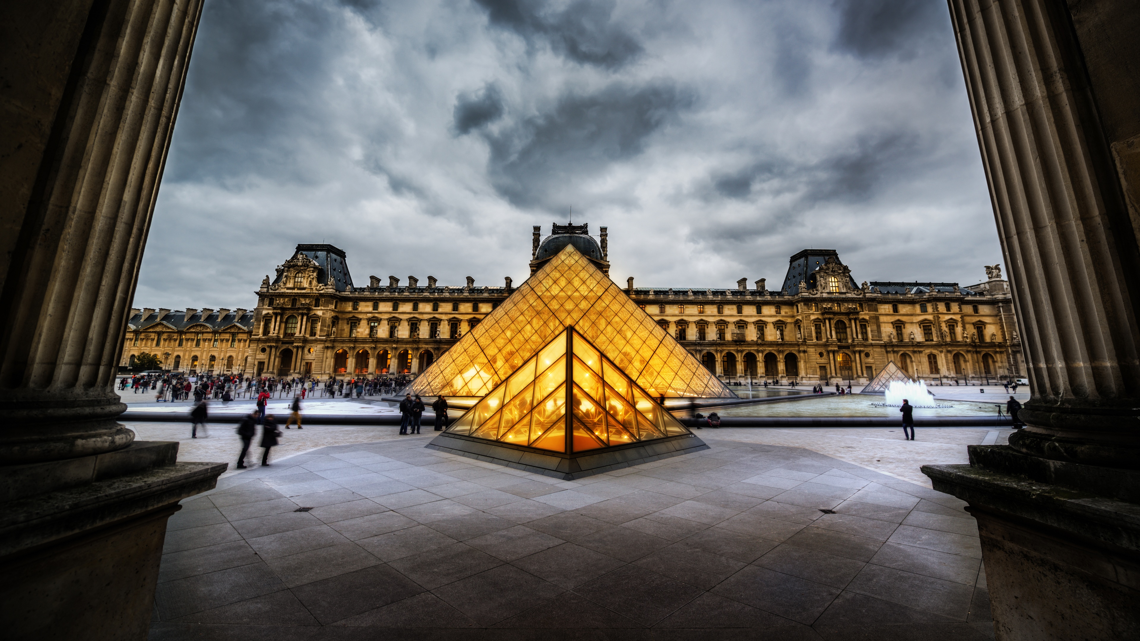 Louvre Pyramid in Paris under cloudy sky HD Wallpaper