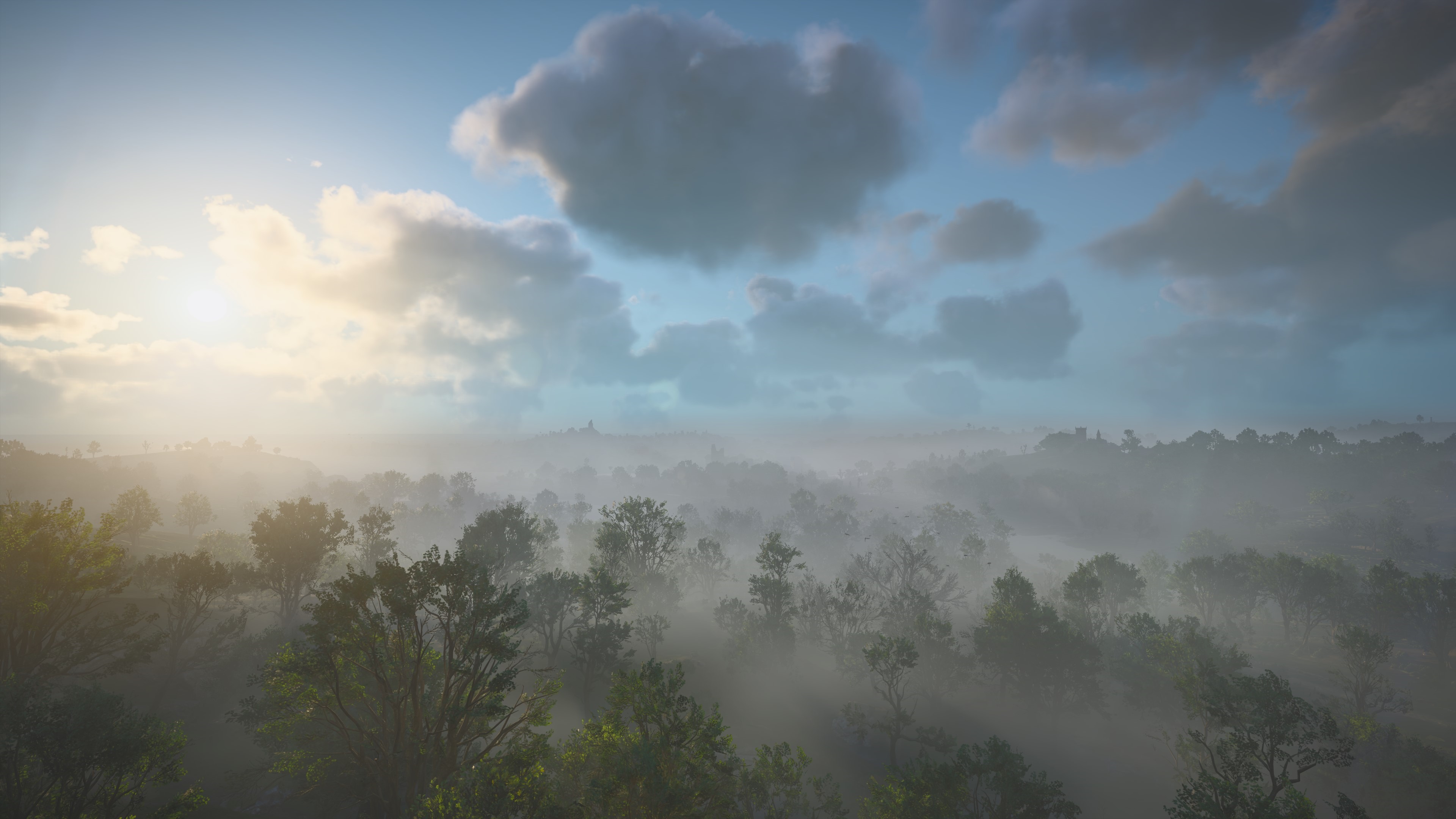 4K HDR trees and clouds over misty landscape HD Wallpaper