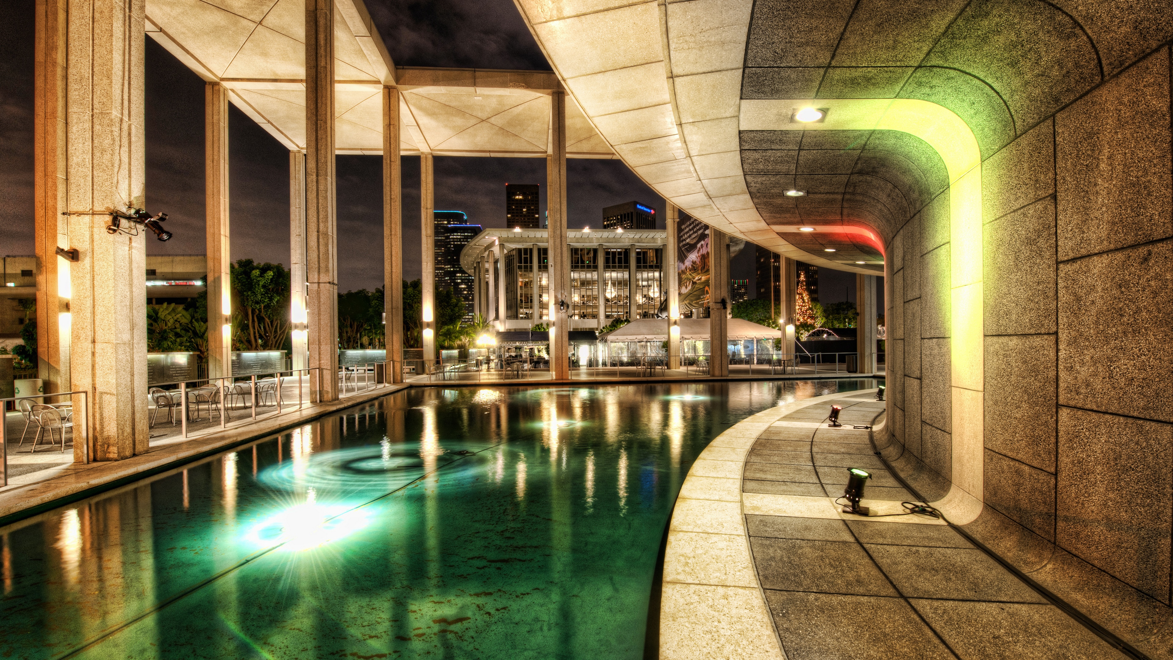 Night view of a modern building with a pool HD Wallpaper