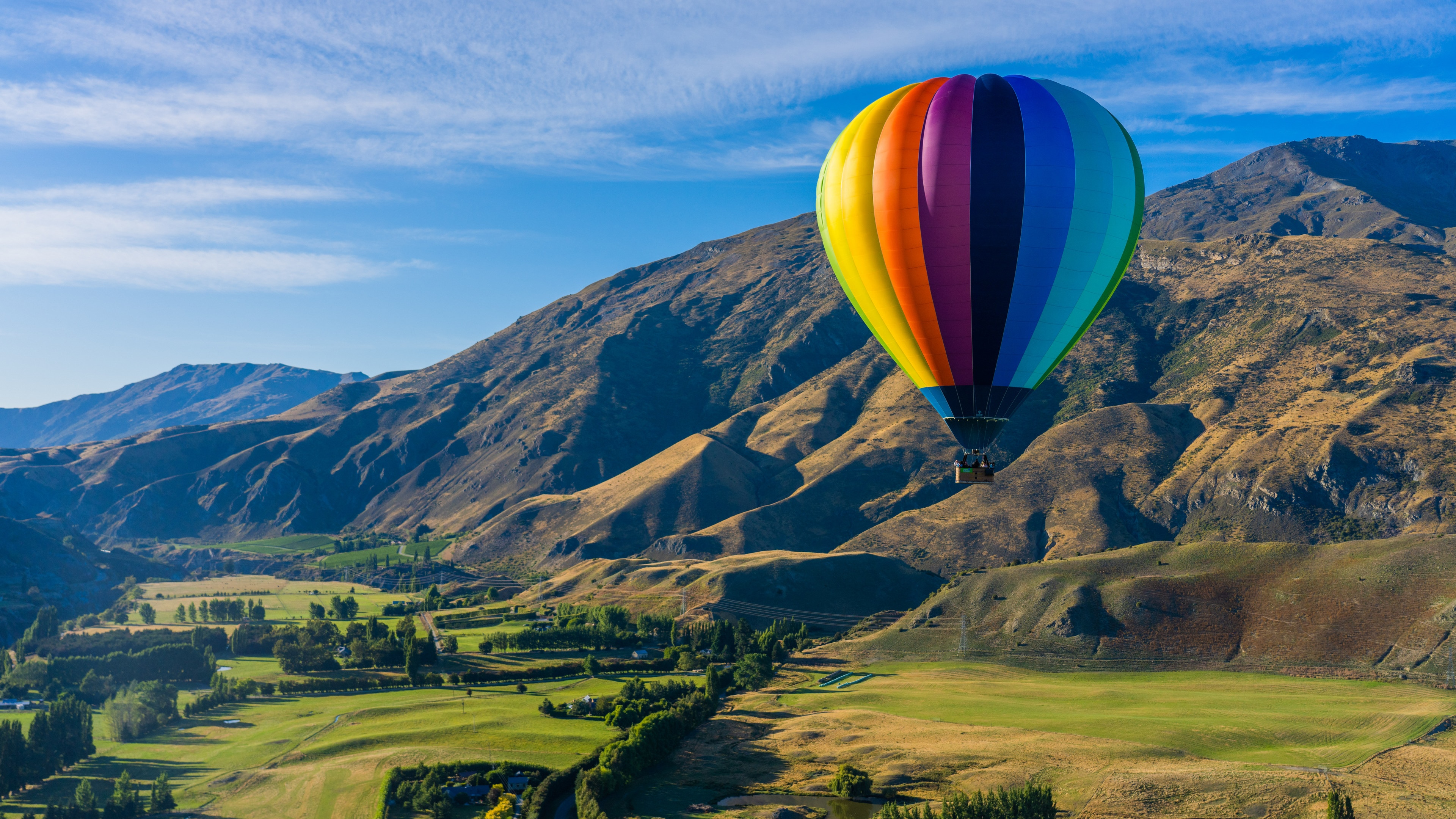 Hot air balloon over mountains in New Zealand HD Wallpaper