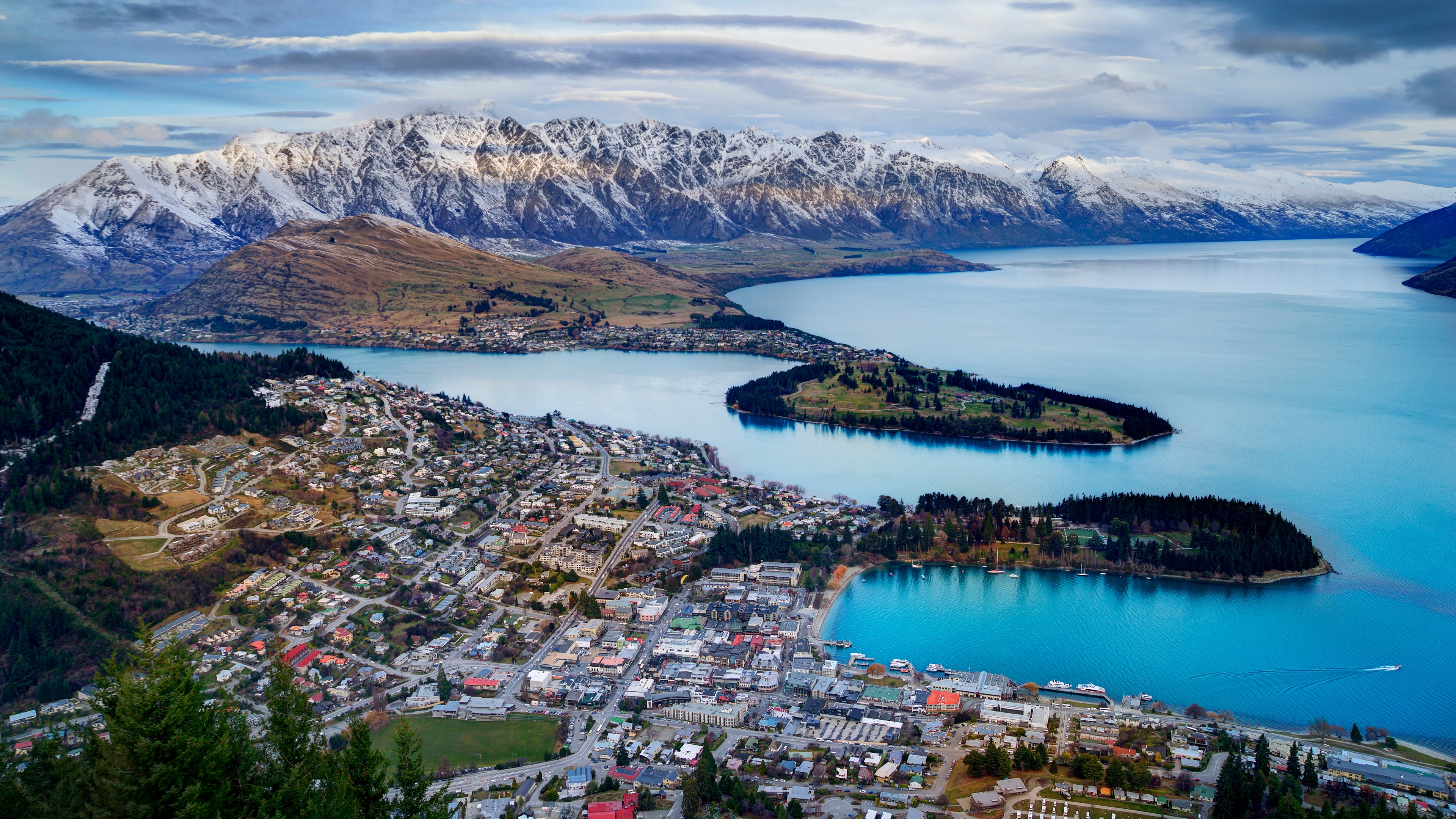 Queenstown cityscape with snow-capped mountains and lake HD Wallpaper