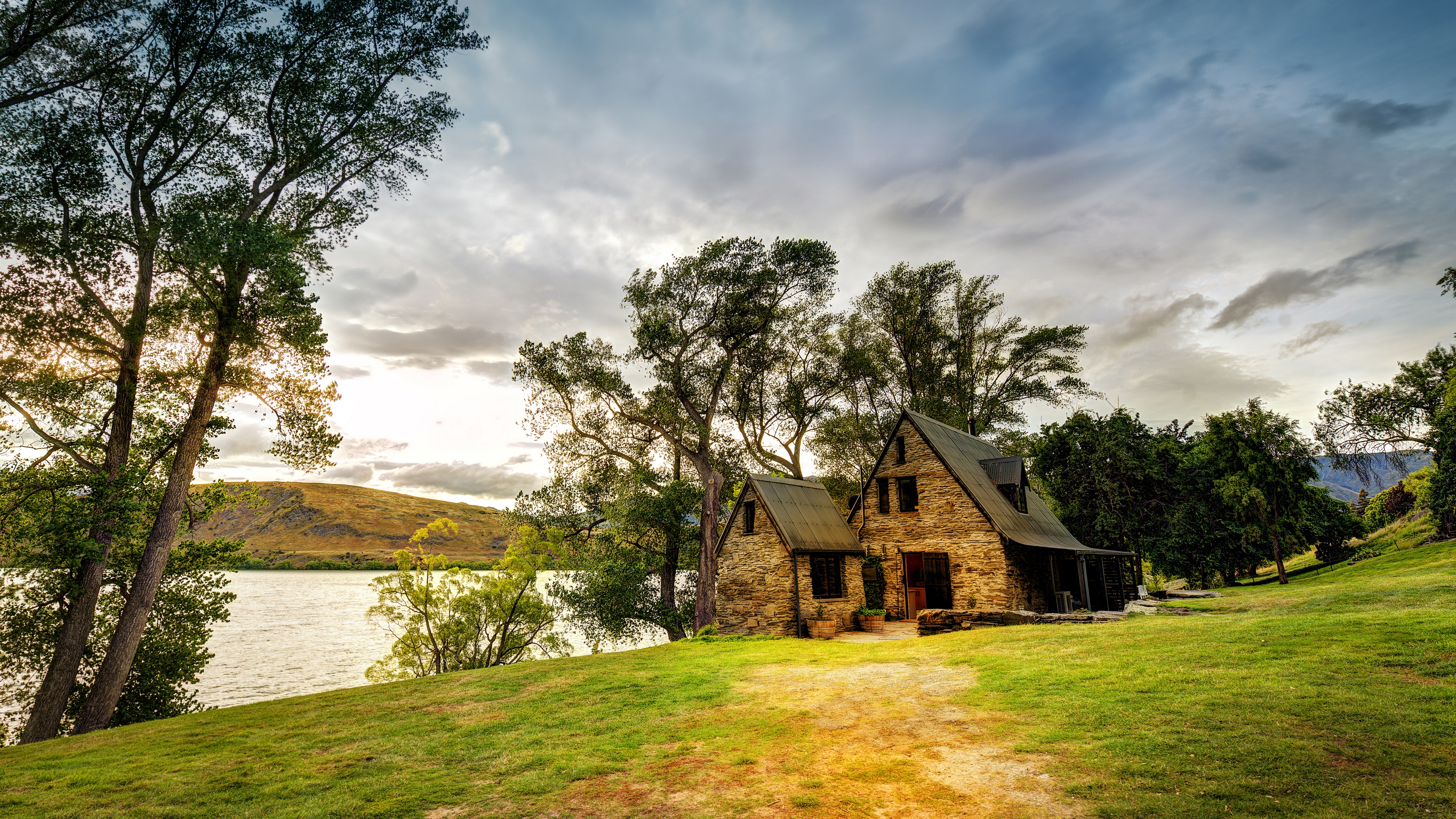 Stone house by a lake in New Zealand HD Wallpaper