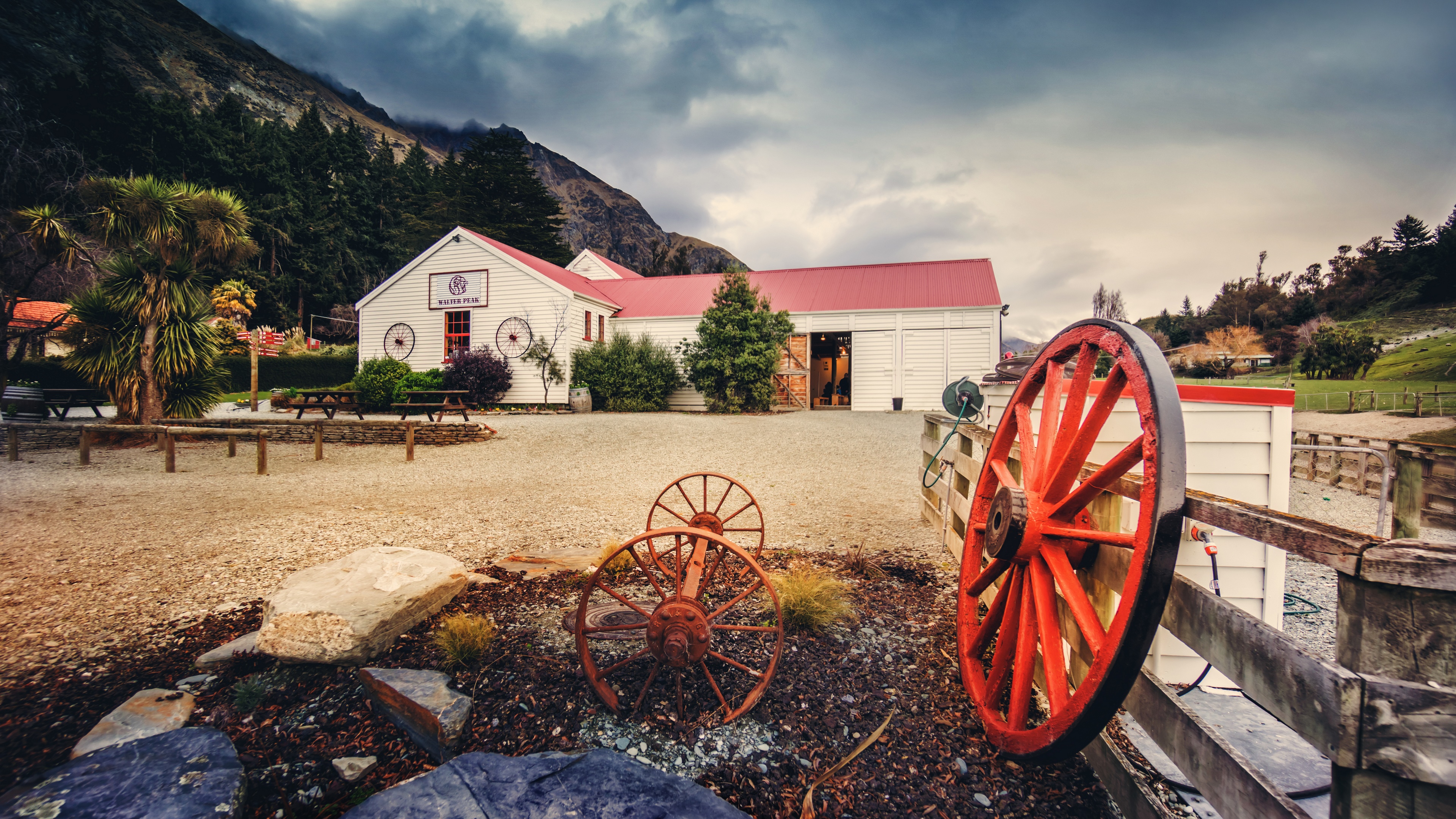 4K landscape of a building with red roof and mountains HD Wallpaper