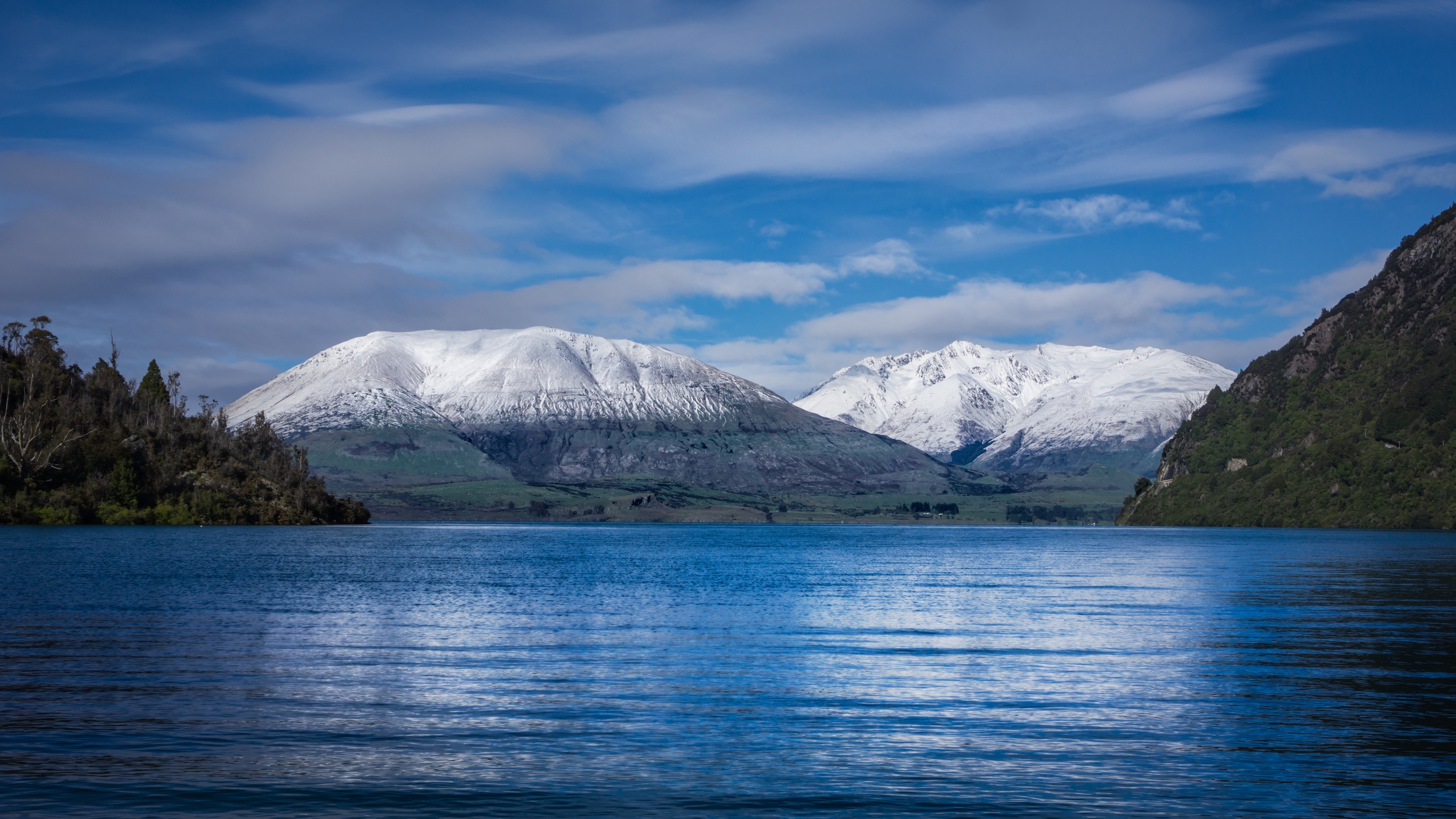 Snow-capped mountains over a blue lake in New Zealand HD Wallpaper