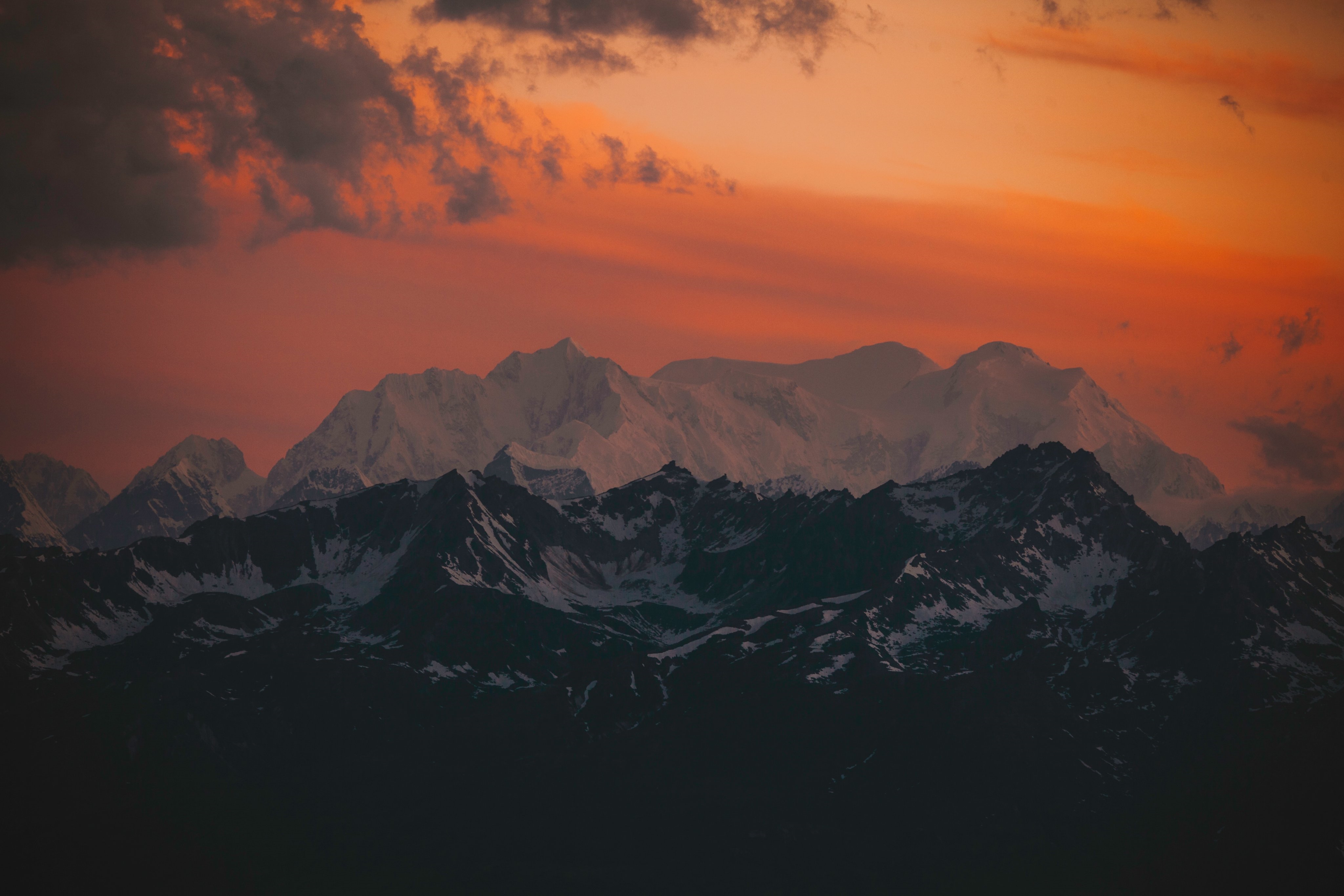 4K snowy mountains at sunset with clouds HD Wallpaper