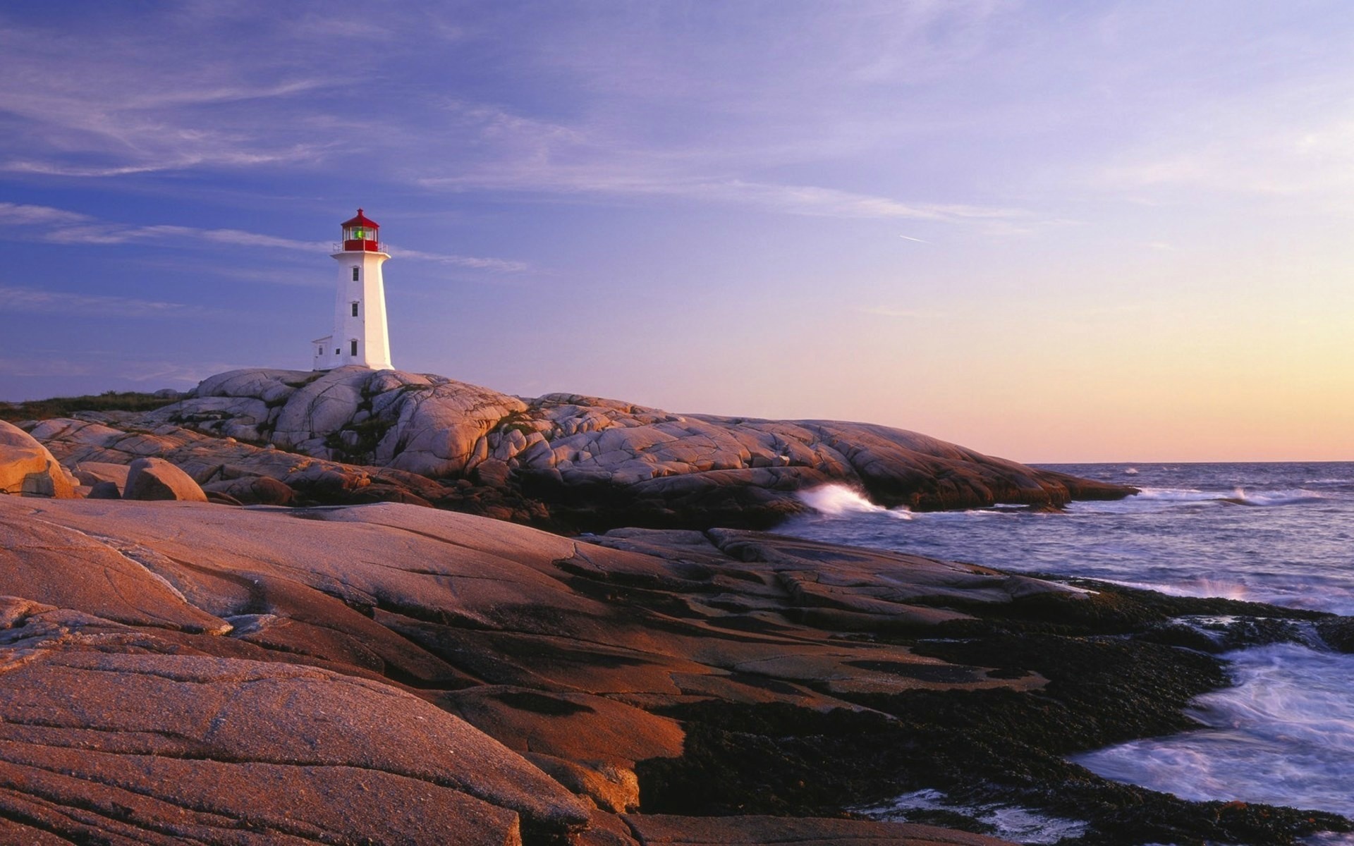 Peggy's Cove Lighthouse on rocky coast at sunset HD Wallpaper