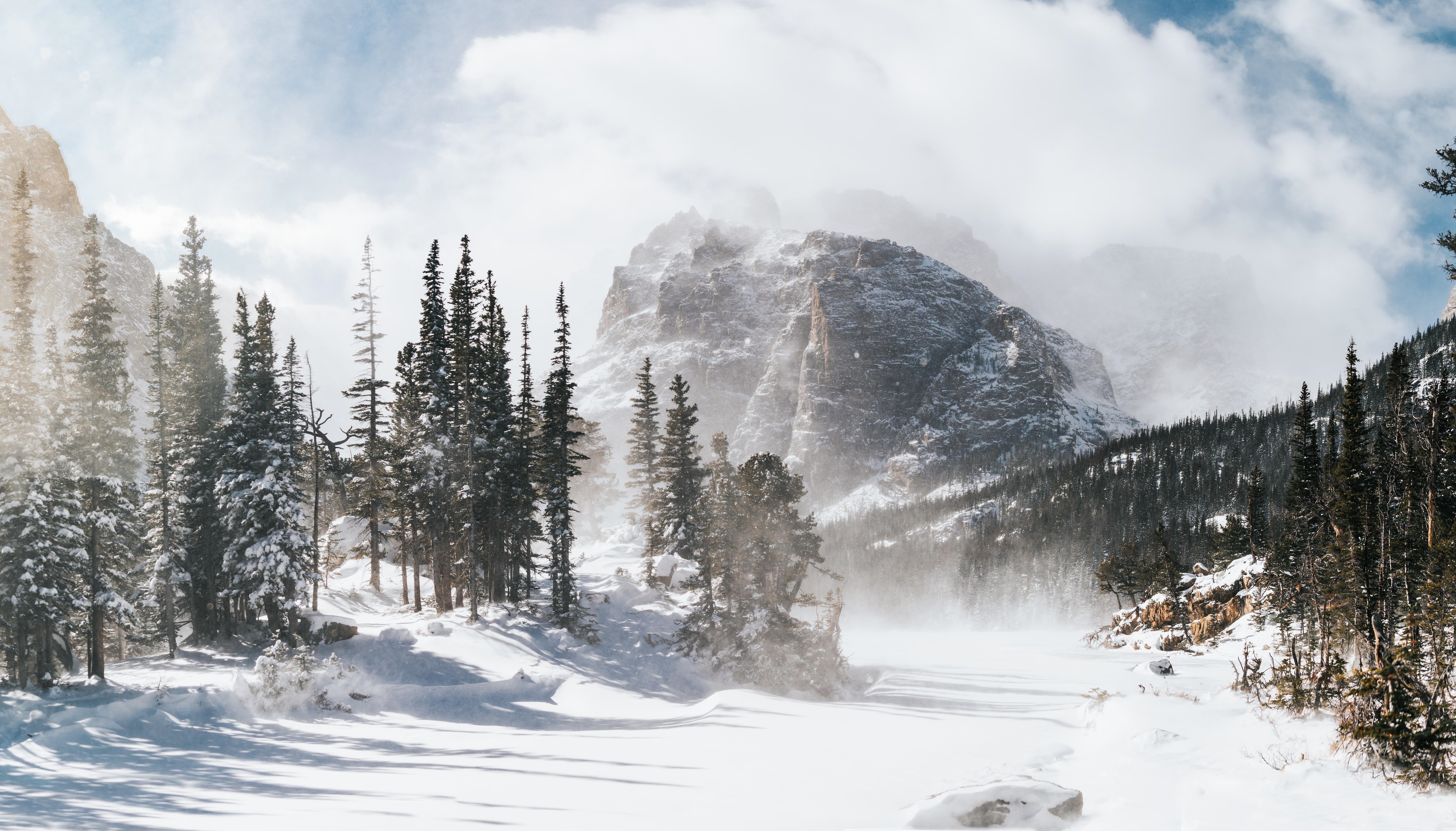 4K Colorado winter landscape with snow-covered mountains and trees HD Wallpaper