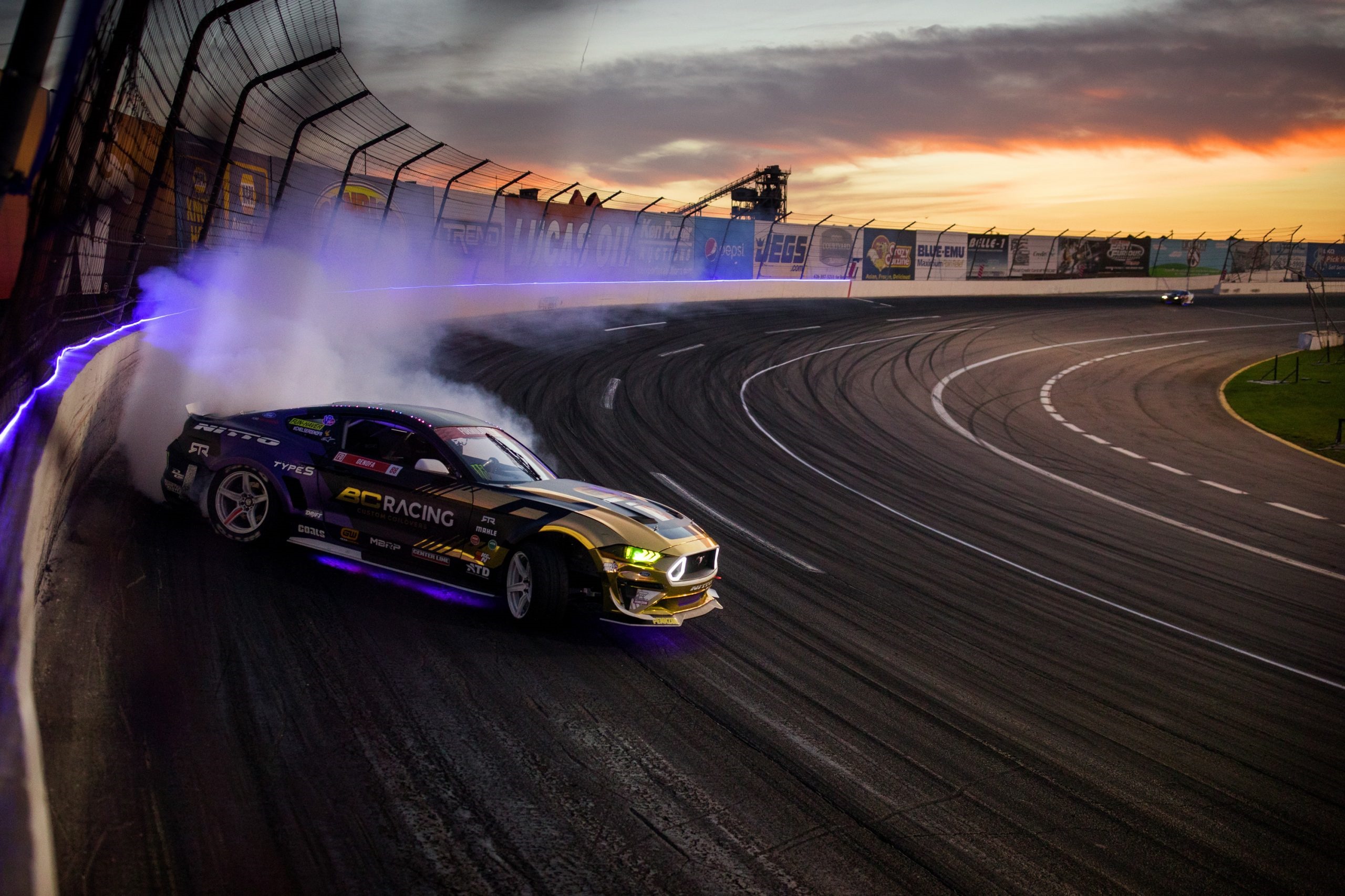 Ford Mustang S550 drifting on a race track HD Wallpaper