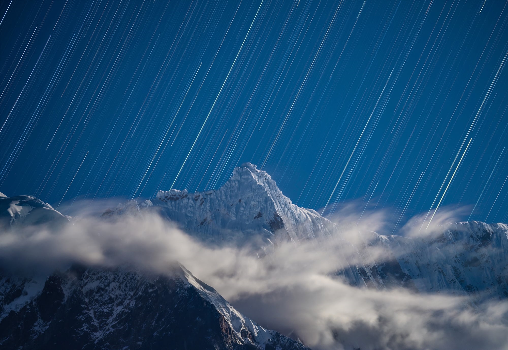 Star trails over snowy Himalayas mountains at night HD Wallpaper