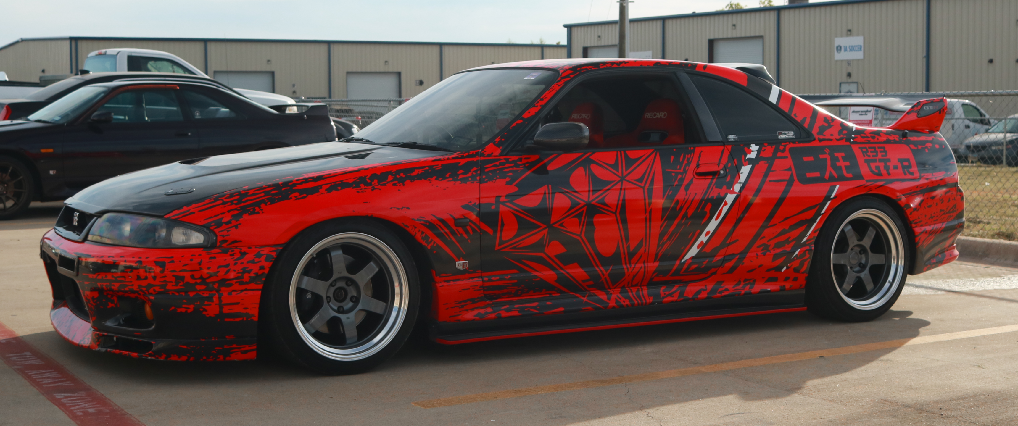 Nissan Skyline R33 GT-R with custom red and black graphics HD Wallpaper