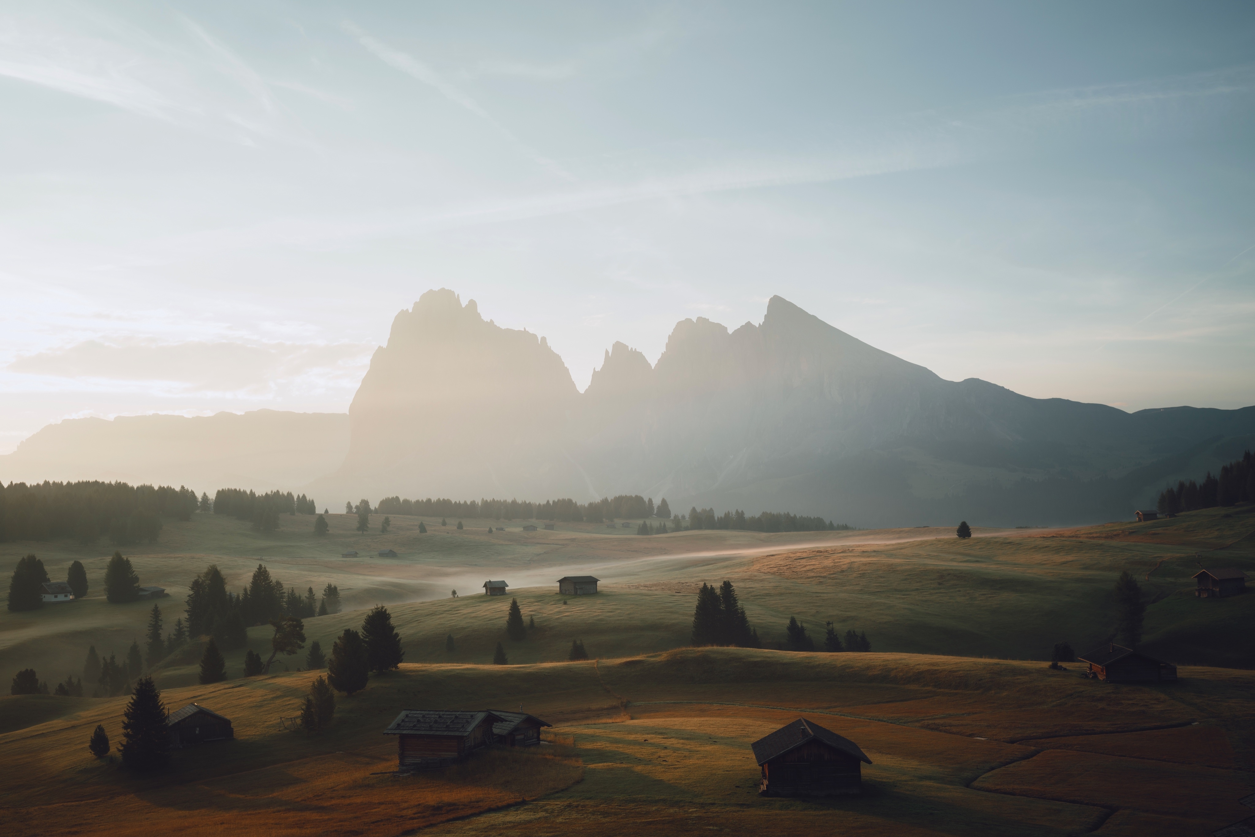 4K misty mountain landscape with cabins HD Wallpaper